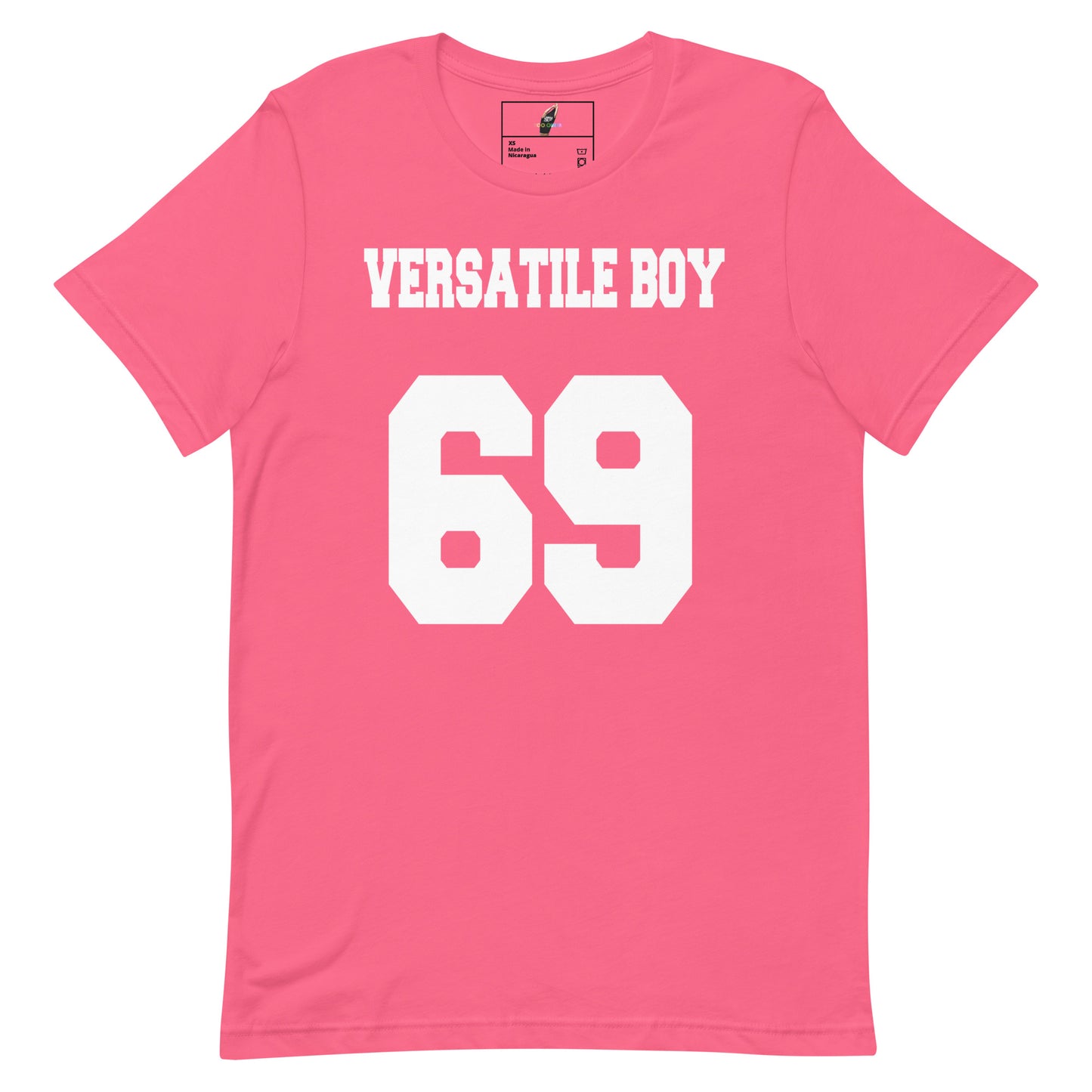 A pink short-sleeve t-shirt with 'VERSATILE BOY' and the number '69' printed in bold white block letters on the front, displayed against a solid white background.