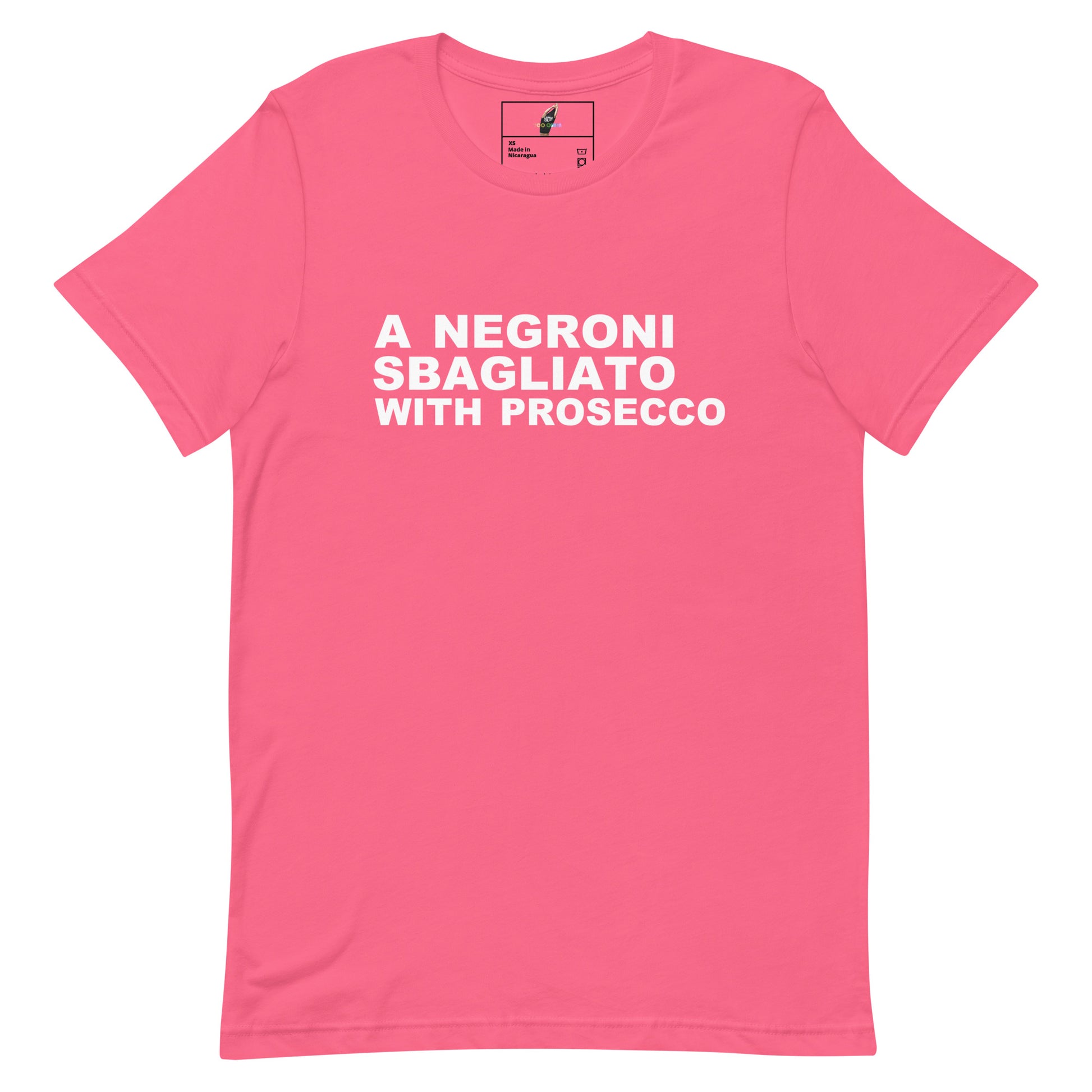 A pink short-sleeve crewneck t-shirt with bold white text on the chest reading 'A NEGRONI SBAGLIATO WITH PROSECCO'. The shirt is displayed flat against a solid white background, with a small brand label visible inside the collar.