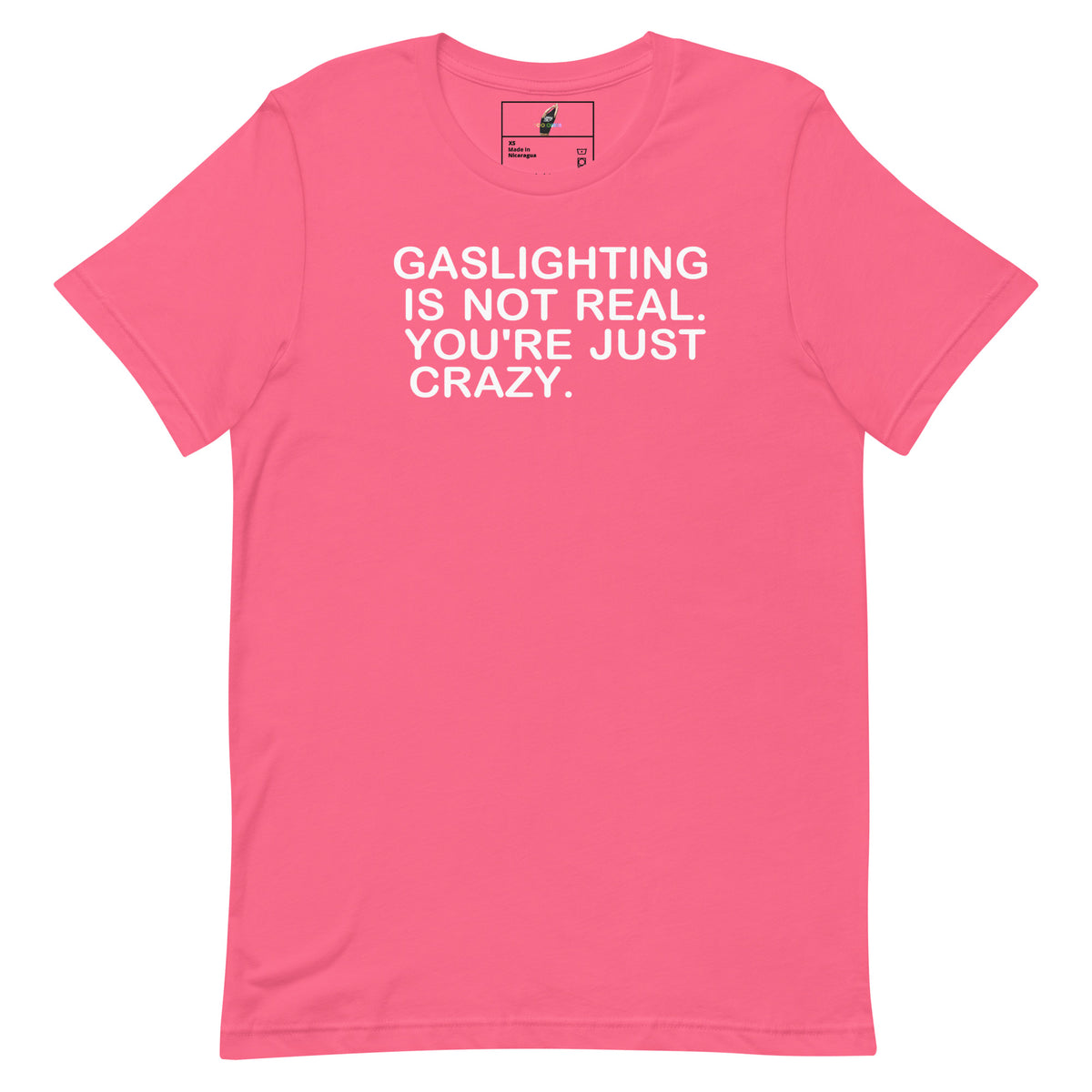 A pink short-sleeve crewneck t-shirt with the text 'GASLIGHTING IS NOT REAL. YOU'RE JUST CRAZY.