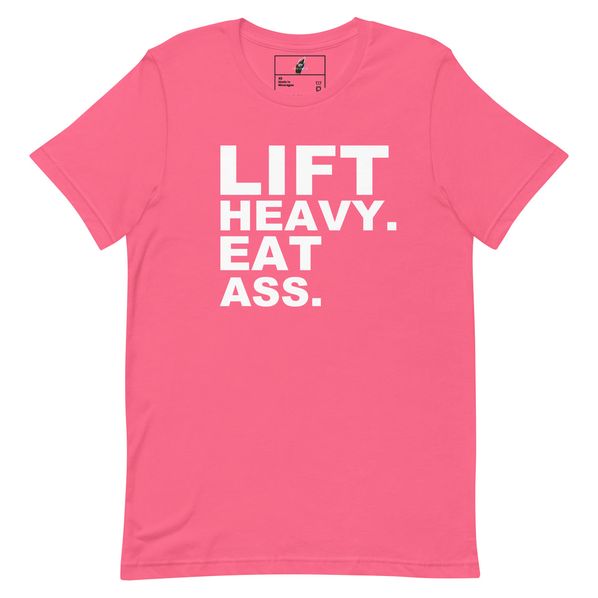 A bright pink short-sleeve t-shirt with bold white text on the front reading 'LIFT HEAVY. EAT ASS.