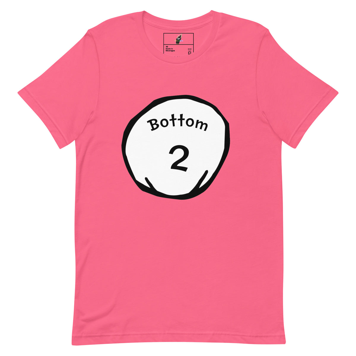 A pink short-sleeve crewneck t-shirt featuring a circular graphic on the chest with the text 'Bottom 2' in black on a white circle with a black outline.