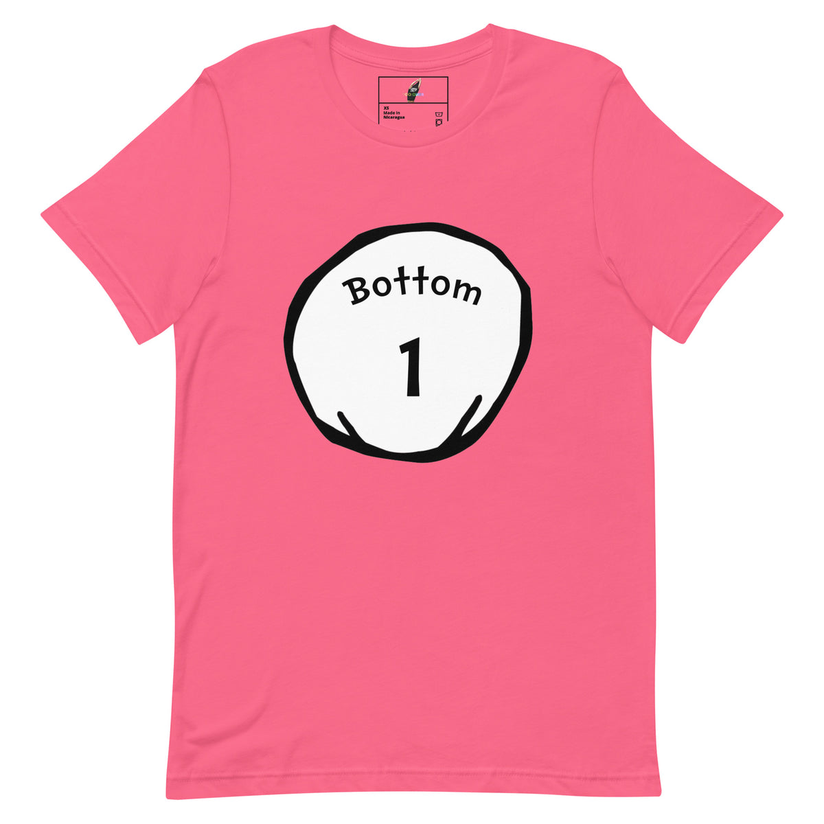 A pink short-sleeve crewneck t-shirt featuring a circular graphic on the chest with the text 'Bottom 1' in black inside a white circle with a black outline.