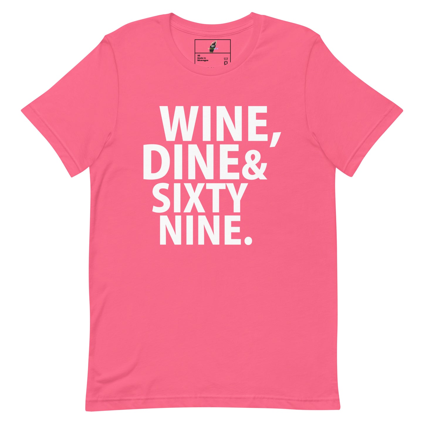 A bright pink short-sleeve t-shirt with bold white text on the front reading 'WINE, DINE & SIXTY NINE.' on a plain white background.
