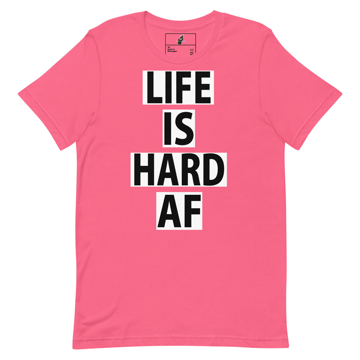 A pink short-sleeve crewneck t-shirt with the text 'LIFE IS HARD AF' printed vertically in black block letters on white rectangular blocks, displayed on a clean white background.