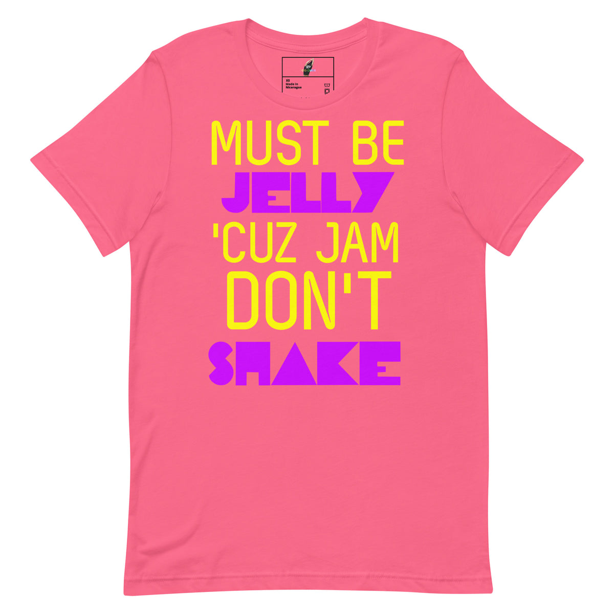 A bright pink short-sleeve t-shirt with a colorful graphic text print reading 'MUST BE JELLY 'CUZ JAM DON'T SHAKE' in yellow and purple lettering, displayed on a solid white background.