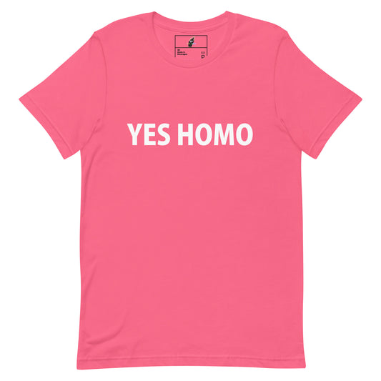 A bright pink short-sleeve crewneck t-shirt with the words 'YES HOMO' printed in bold white capital letters across the chest, displayed flat against a solid white background.