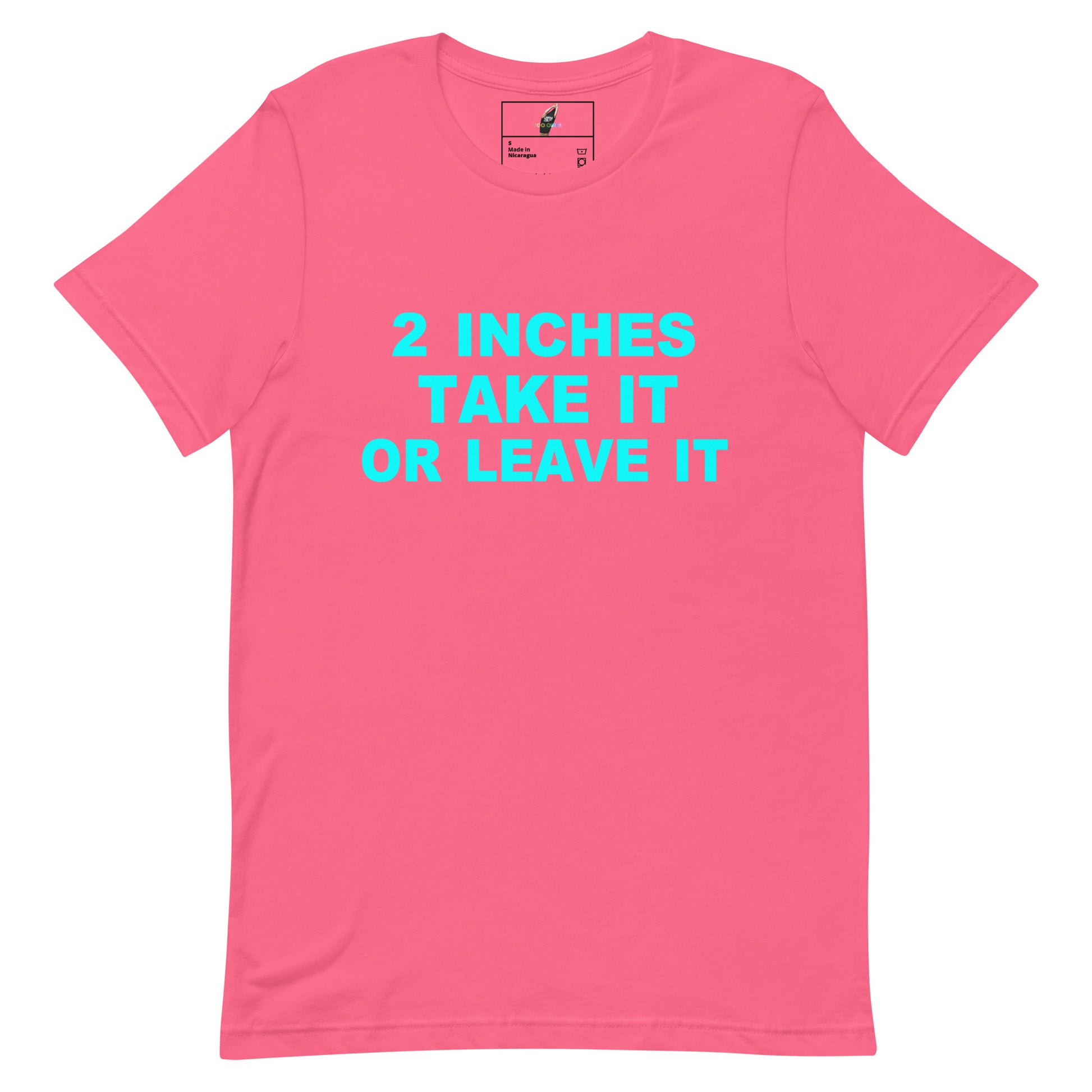 A bright pink short-sleeve crewneck t-shirt with the text '2 INCHES TAKE IT OR LEAVE IT' printed in a vibrant cyan blue font across the chest.