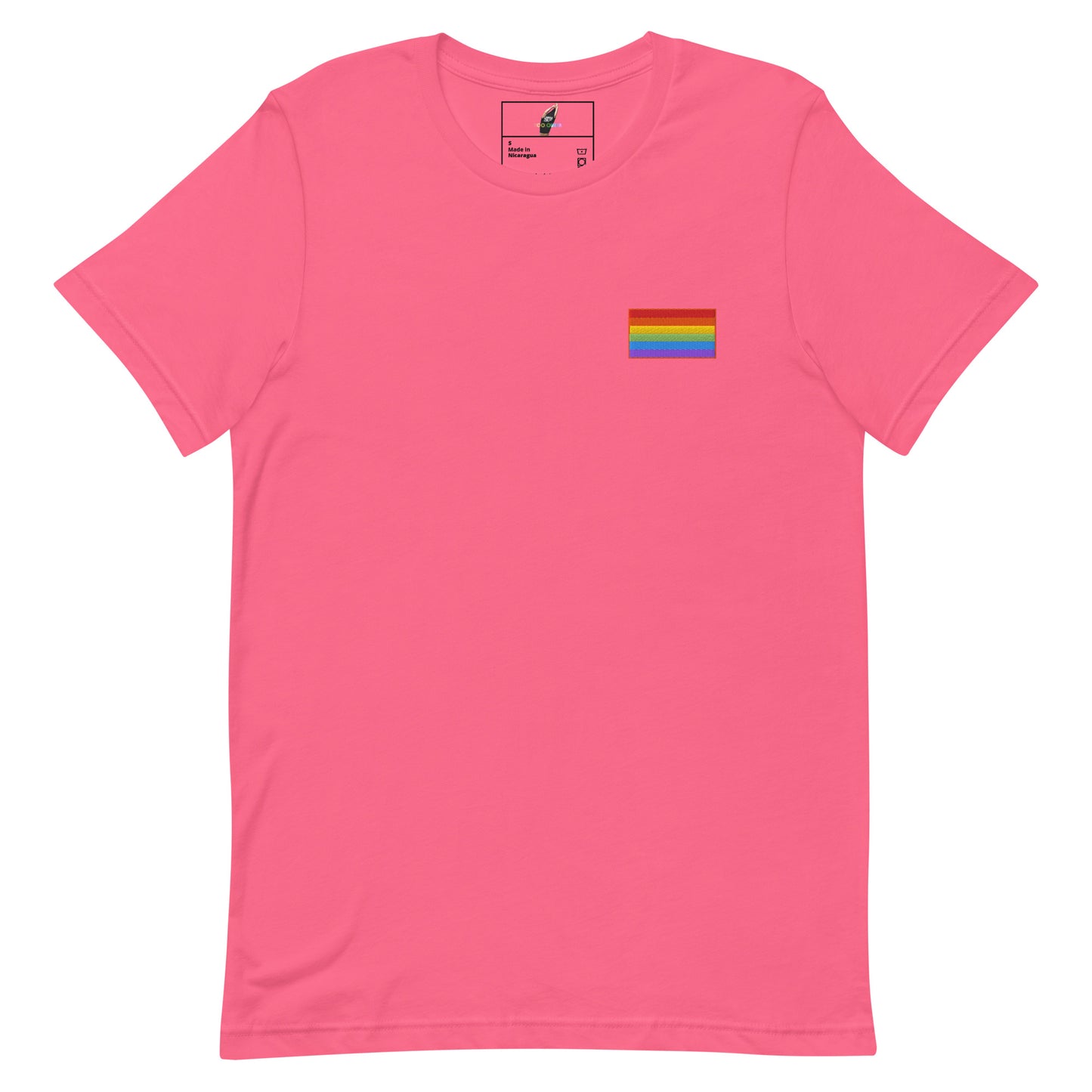 A pink short-sleeve crewneck t-shirt with a small rainbow pride flag graphic printed on the left chest, displayed on a clean white background.