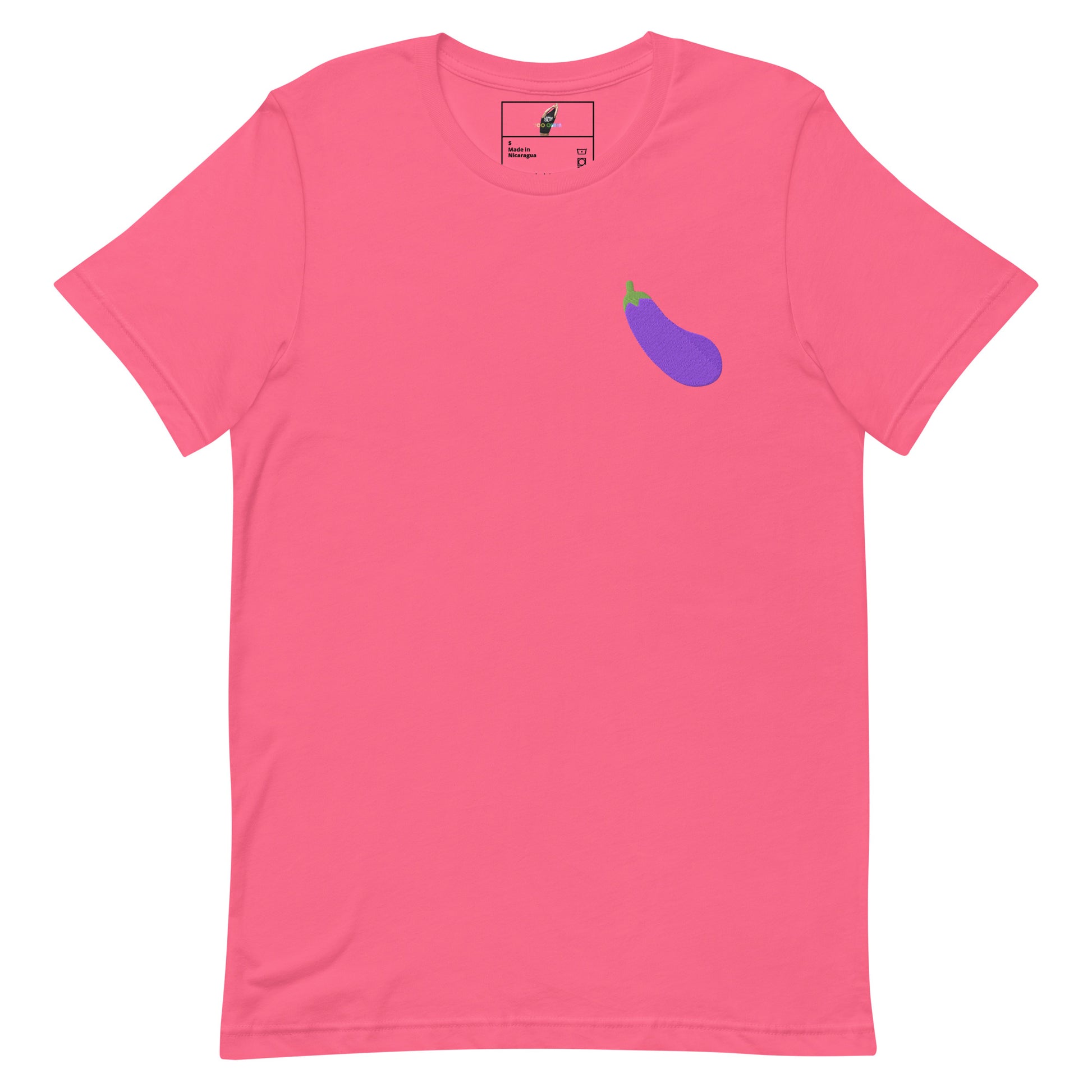 A pink short-sleeve crewneck t-shirt featuring a small purple eggplant graphic on the left chest, displayed on a clean white background.