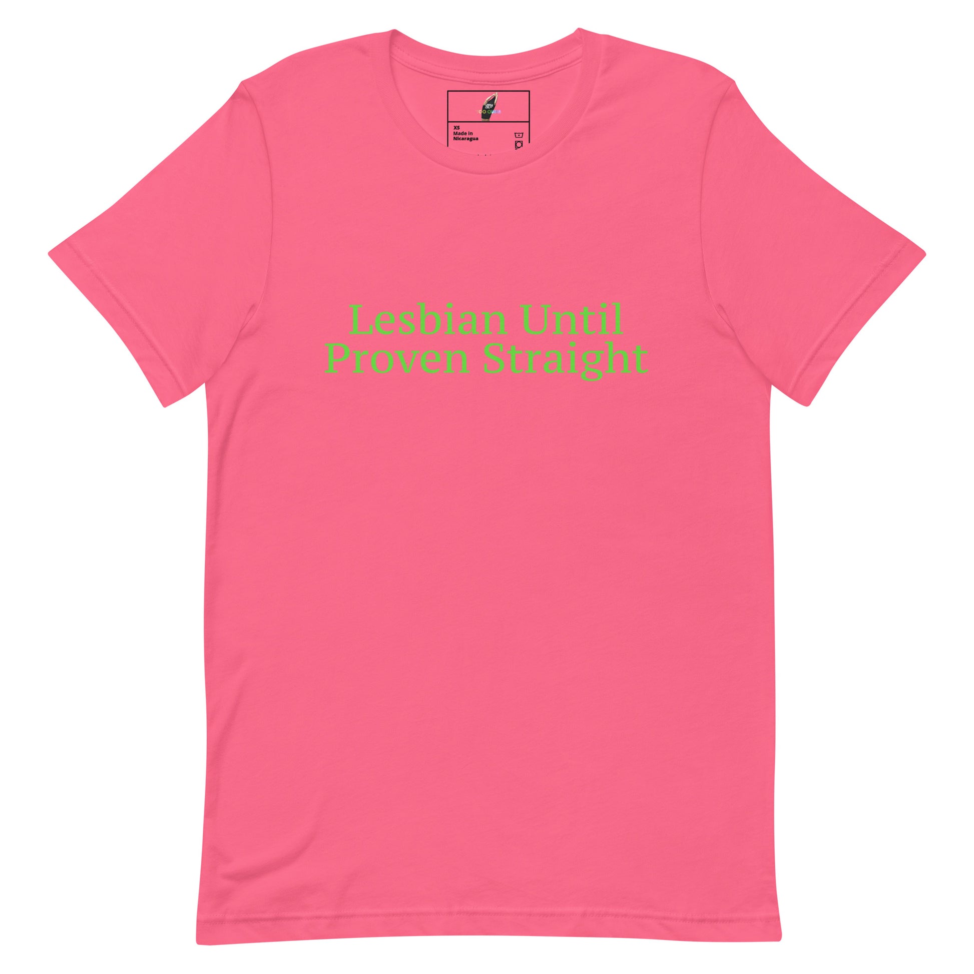 A pink short-sleeve crewneck t-shirt with the phrase 'Lesbian Until Proven Straight' printed in light green text across the chest, displayed flat against a white background.