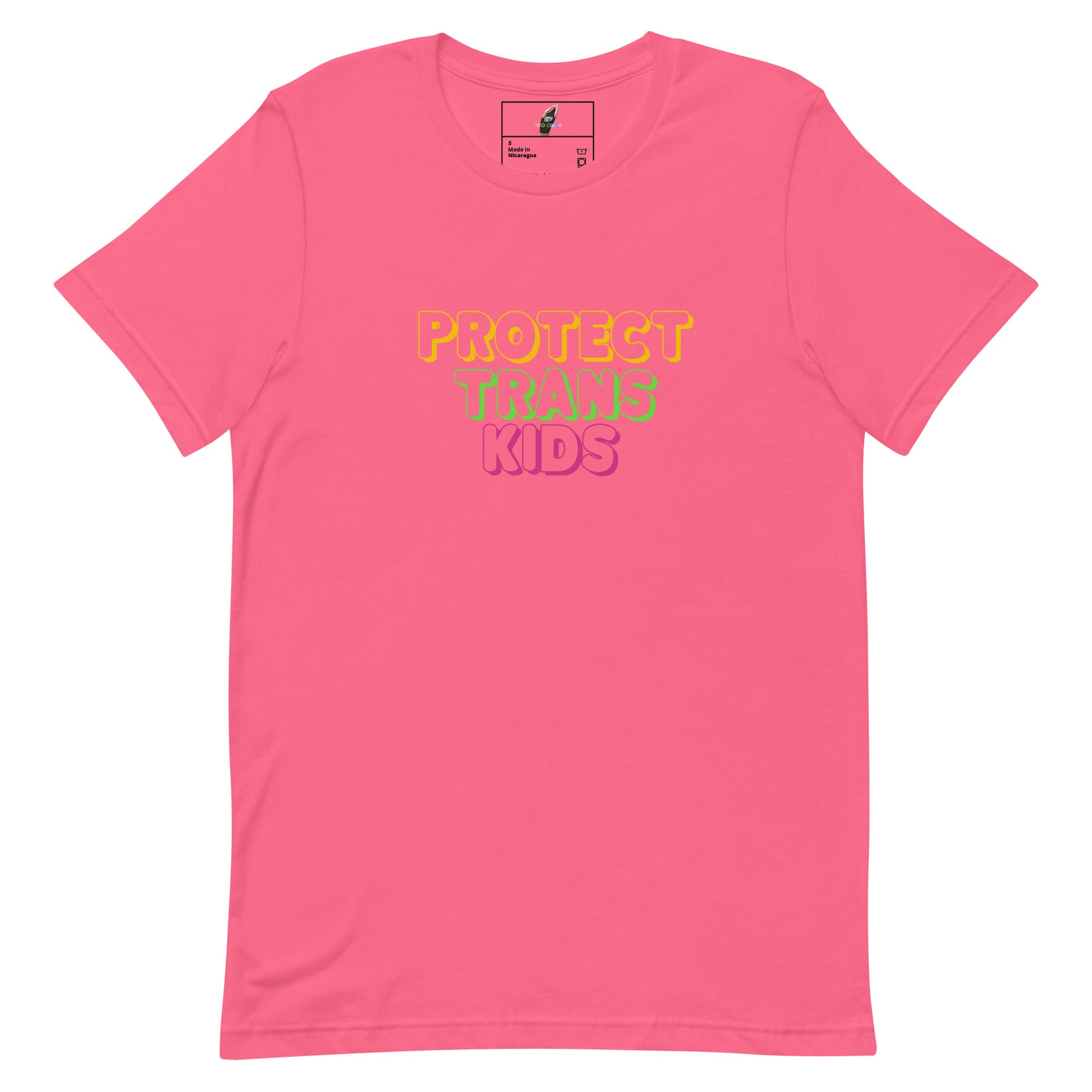 A pink short-sleeve crewneck t-shirt with the text 'PROTECT TRANS KIDS' printed on the chest in yellow, green, and pink lettering, displayed on a clean white background.
