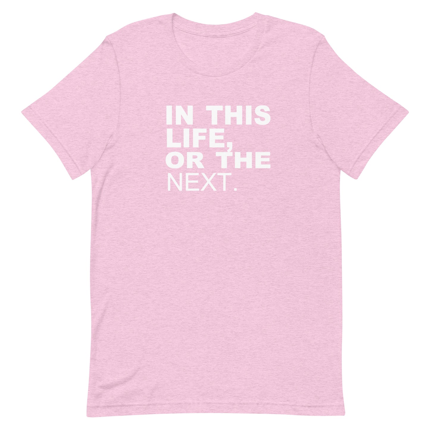 A light pink heathered short-sleeve t-shirt with the phrase 'IN THIS LIFE, OR THE NEXT.' printed in bold white capital letters on the chest, displayed against a solid white background.