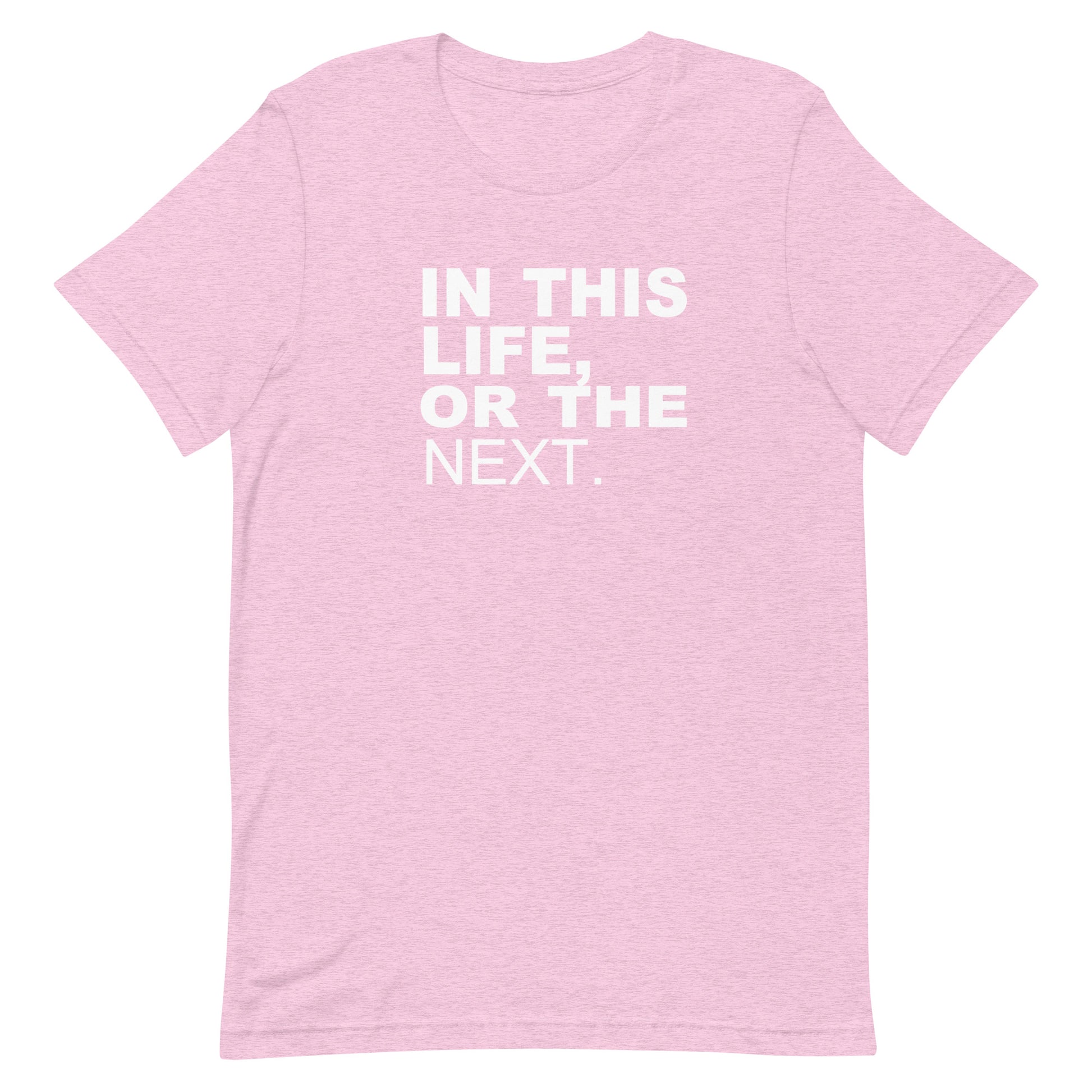 A light pink heathered short-sleeve t-shirt with the phrase 'IN THIS LIFE, OR THE NEXT.' printed in bold white capital letters on the chest, displayed against a solid white background.