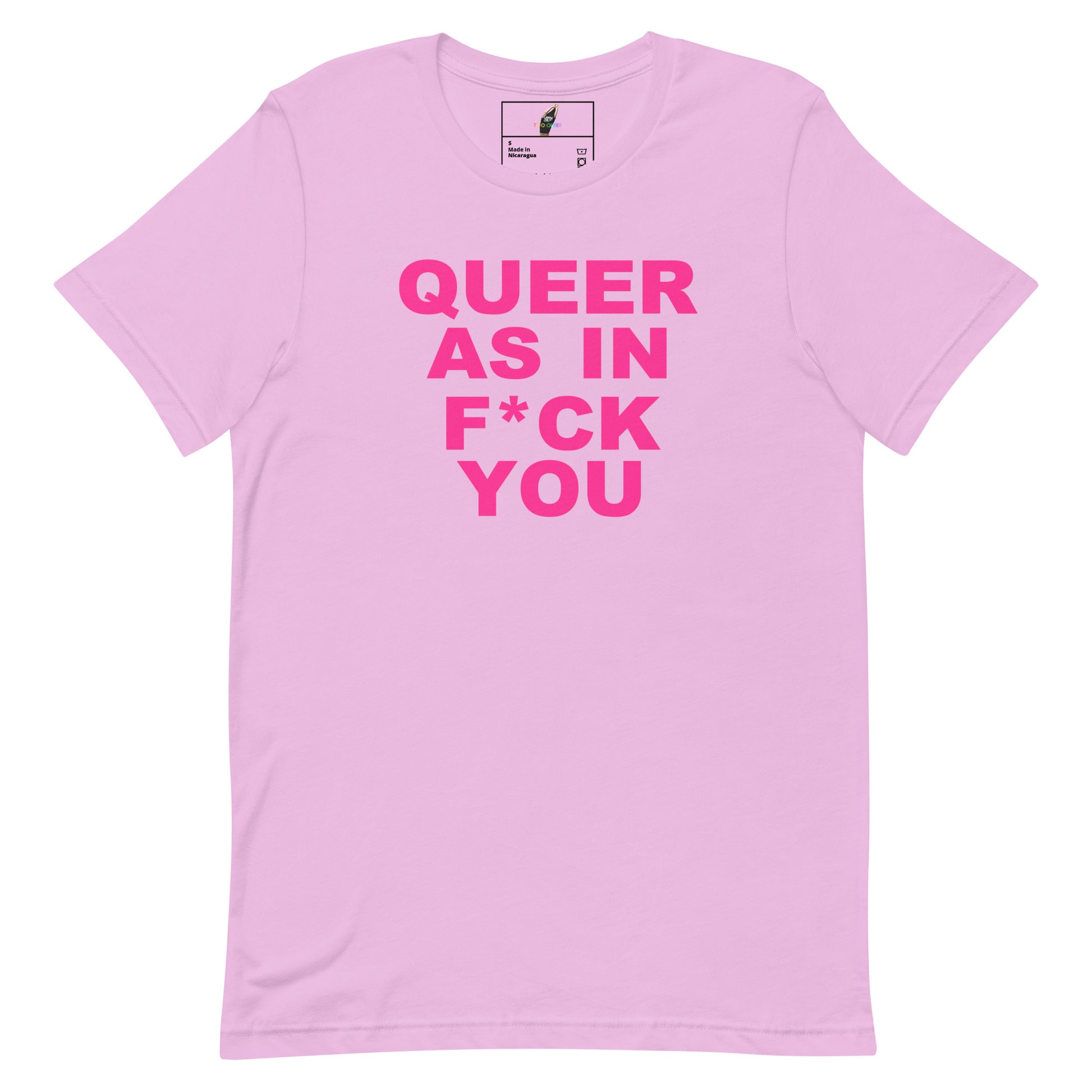 A light pink short-sleeve t-shirt with bold hot pink text on the front reading 'QUEER AS IN F*CK YOU'. The shirt is displayed flat against a clean white background, showing a small brand label inside the collar.