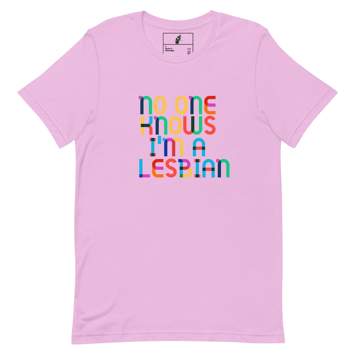 A light pink short-sleeve t-shirt with a colorful graphic text reading 'no one knows i'm a lesbian' in rainbow-colored letters, displayed on a clean white background.