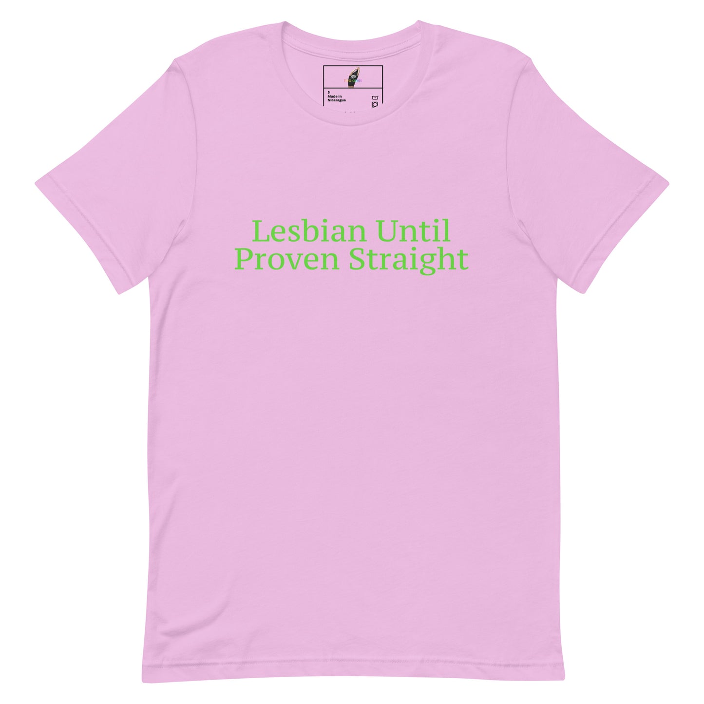 A light pink short-sleeve crewneck t-shirt with the phrase 'Lesbian Until Proven Straight' printed in green text across the chest. The shirt is displayed flat against a solid white background.