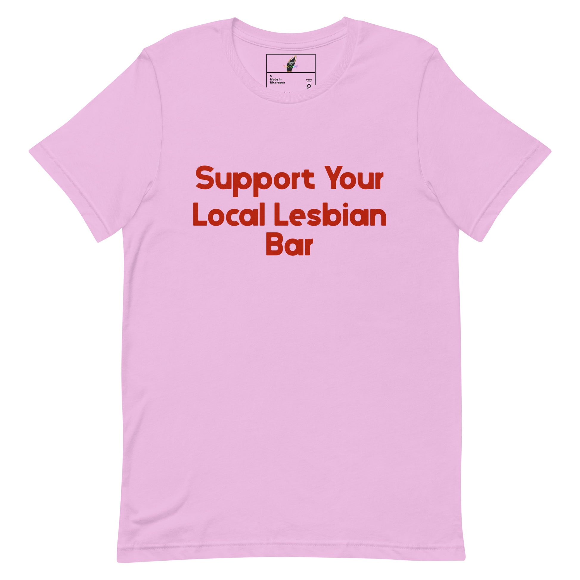A light pink short-sleeve crewneck t-shirt with the text 'Support Your Local Lesbian Bar' printed in red across the chest, displayed on a solid white background.