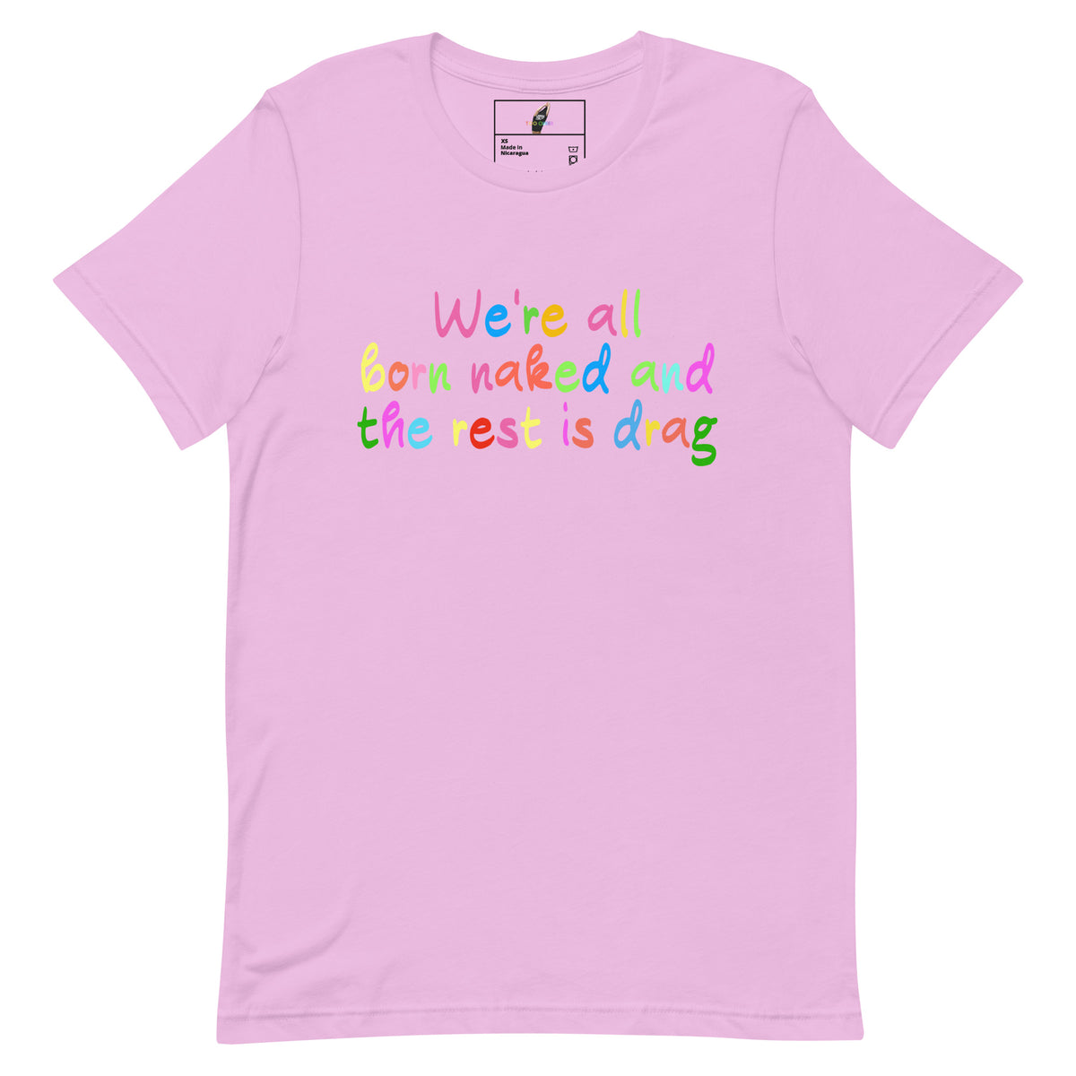 A light pink short-sleeve crewneck t-shirt featuring a colorful text graphic on the chest that reads 'We're all born naked and the rest is drag' in rainbow-colored letters.