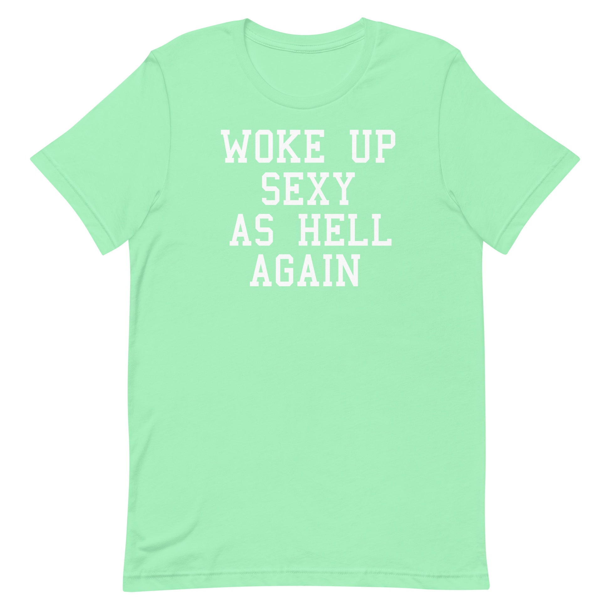 A mint green short-sleeve t-shirt with the phrase 'WOKE UP SEXY AS HELL AGAIN' printed in white block letters across the chest, displayed on a solid white background.