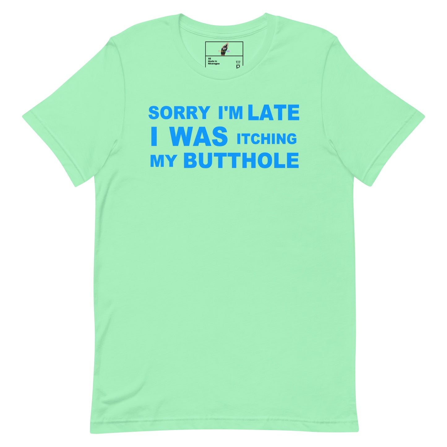 A mint green short-sleeve t-shirt with blue text on the front reading 'SORRY I'M LATE I WAS ITCHING MY BUTTOHOLE'.