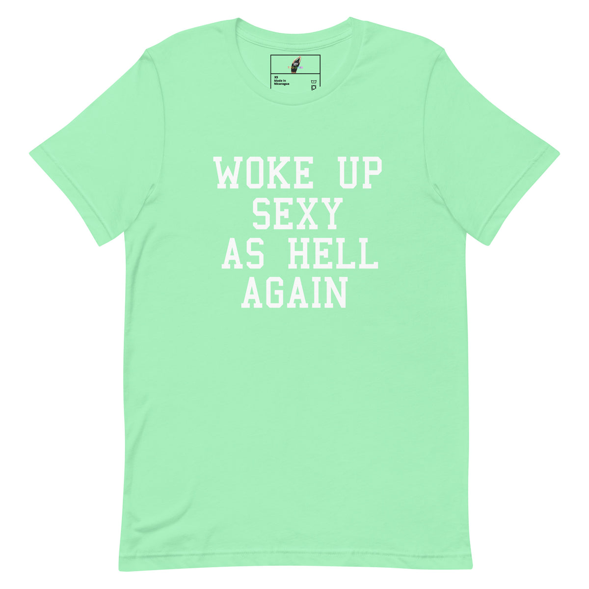 A mint green short-sleeve t-shirt with the phrase 'WOKE UP SEXY AS HELL AGAIN' printed in white block letters across the chest, displayed on a solid white background.