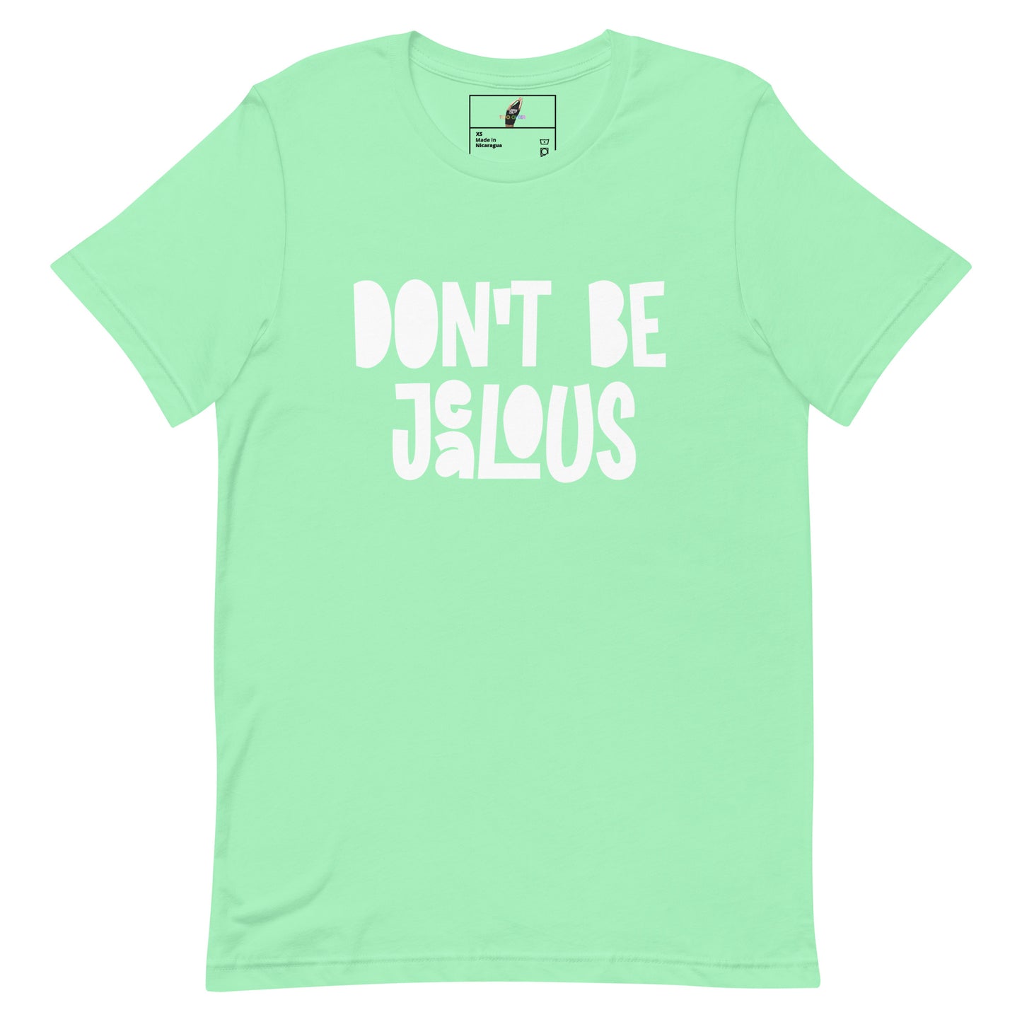 A mint green short-sleeve t-shirt with the phrase 'DON'T BE JALOUS' printed in a bold, white, hand-drawn style font across the chest. The shirt is displayed flat against a solid white background, with a small brand label visible inside the collar.