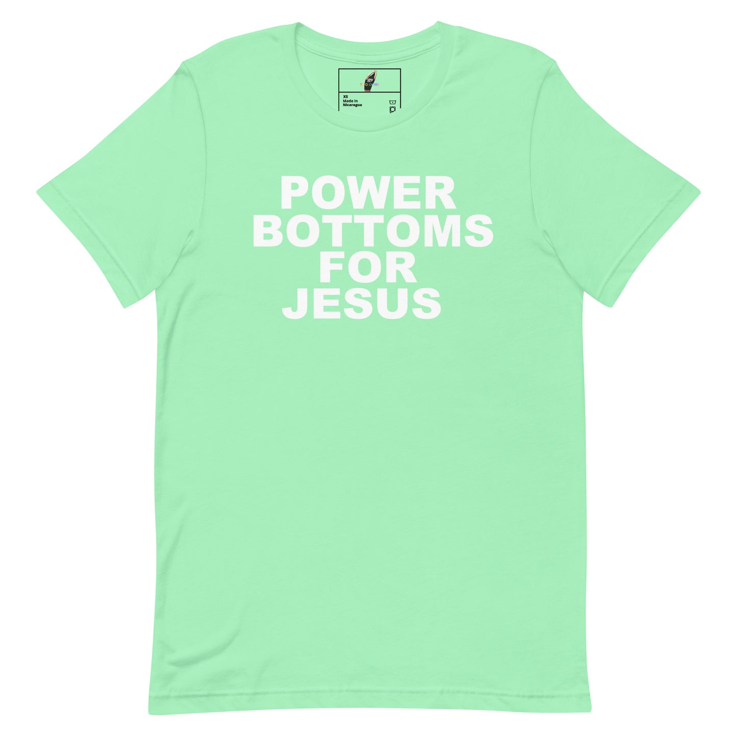 A mint green short-sleeve t-shirt with the phrase 'POWER BOTTOMS FOR JESUS' printed in bold white capital letters across the chest, displayed flat against a solid white background.