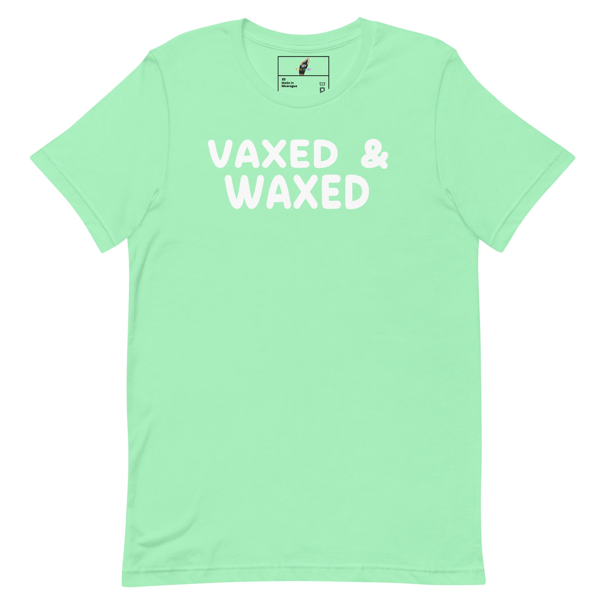 A mint green short-sleeve t-shirt with the words 'VAXED & WAXED' printed in white across the chest, displayed flat against a solid white background.