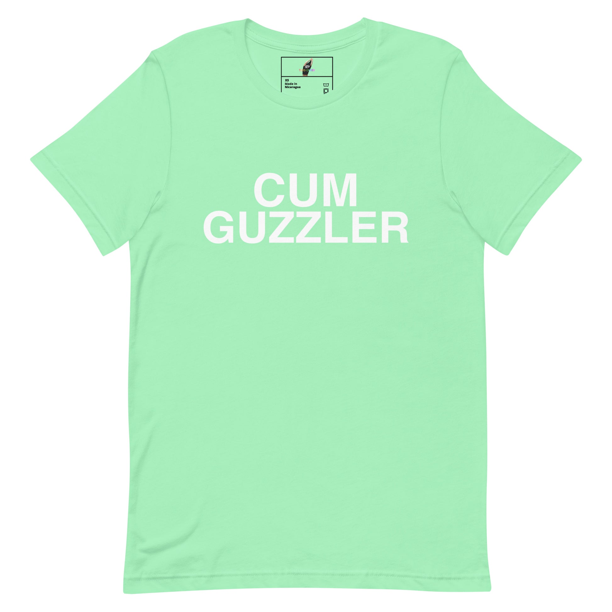 A mint green short-sleeve crewneck t-shirt with the words 'CUM GUZZLER' printed in bold white capital letters across the chest, displayed flat against a solid white background.