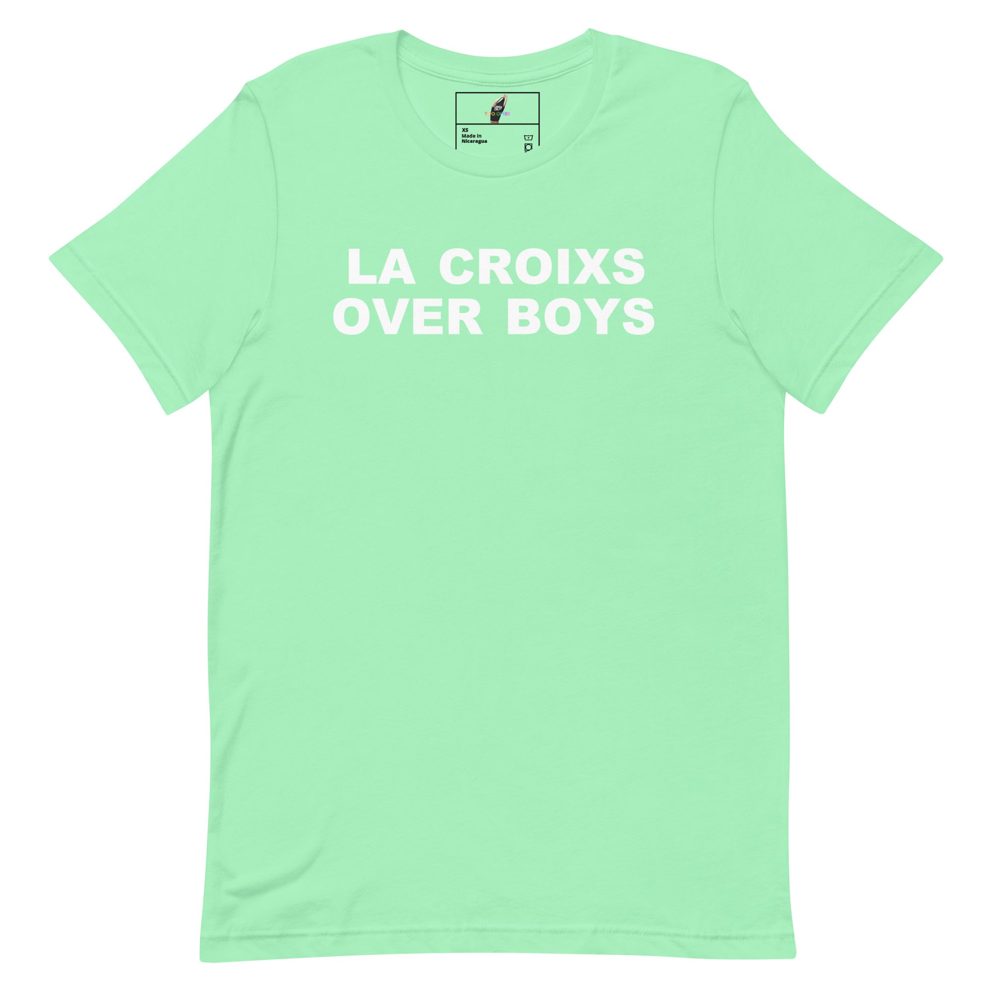 A mint green short-sleeve t-shirt with the phrase 'LA CROIXS OVER BOYS' printed in bold white capital letters across the chest, displayed flat against a solid white background.