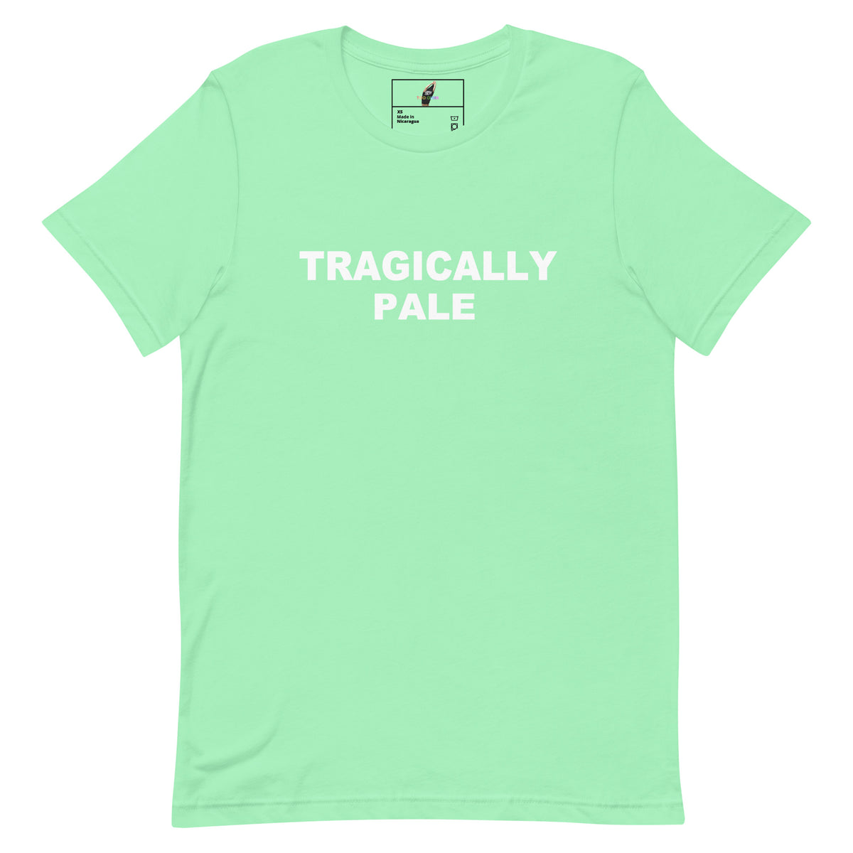 A mint green short-sleeve crewneck t-shirt with the words 'TRAGICALLY PALE' printed in white across the chest, displayed on a clean white background.