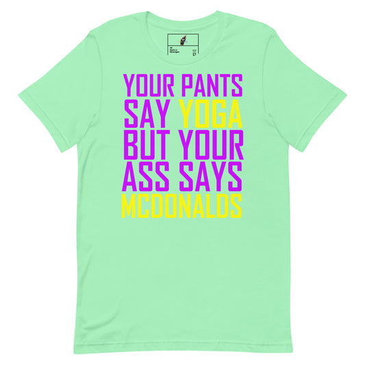A mint green short-sleeve t-shirt with a bold graphic text print in purple and yellow on the front, displayed against a solid white background.