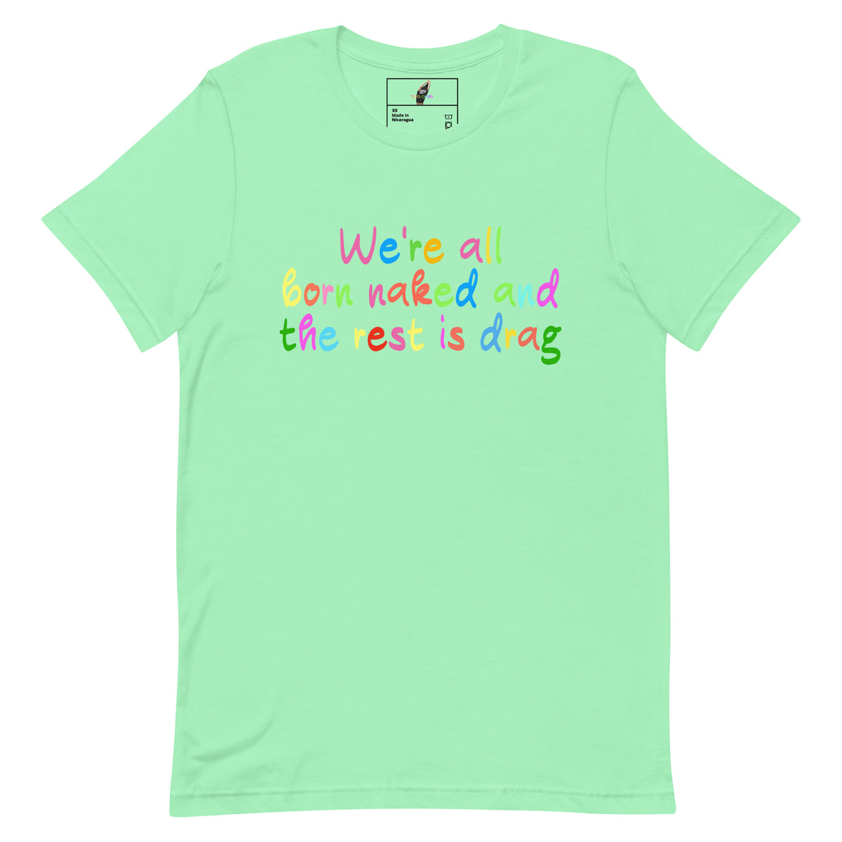 A mint green short-sleeve t-shirt with a colorful text graphic on the chest that reads 'We're all born naked and the rest is drag' in rainbow lettering. The shirt is displayed flat against a solid white background.