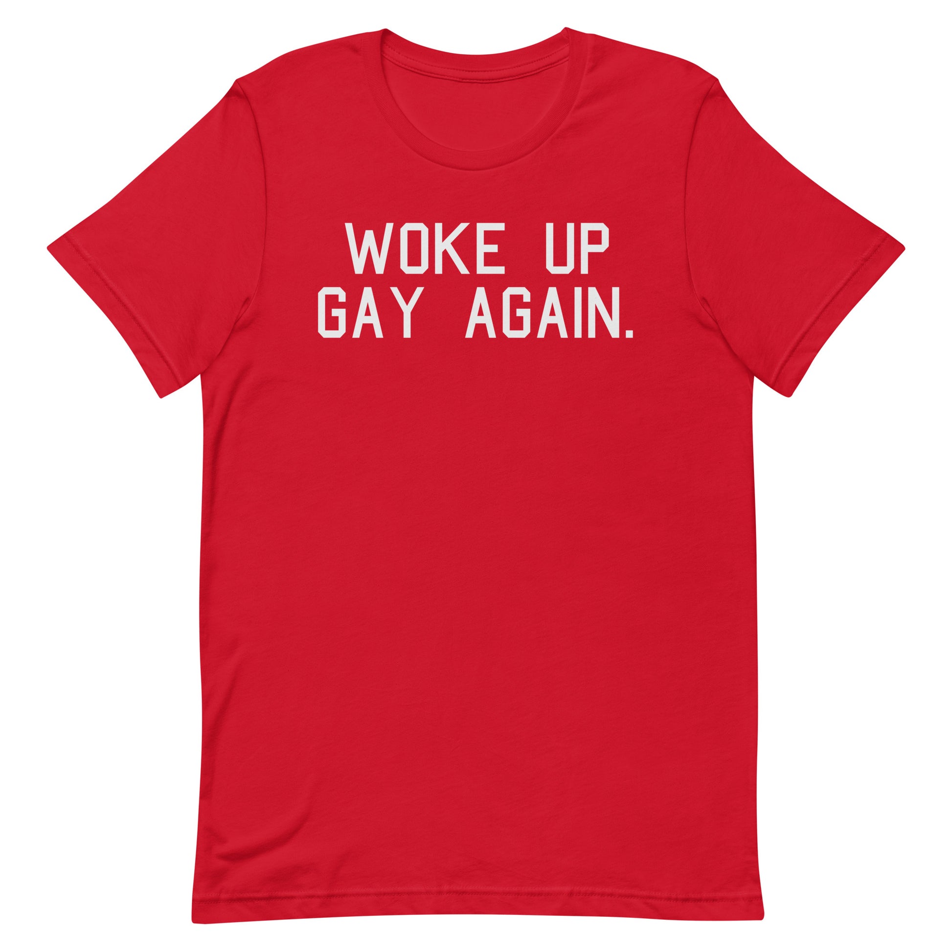 A red short-sleeve crewneck t-shirt with the phrase 'WOKE UP GAY AGAIN.' printed in white block letters across the chest, displayed on a solid white background.