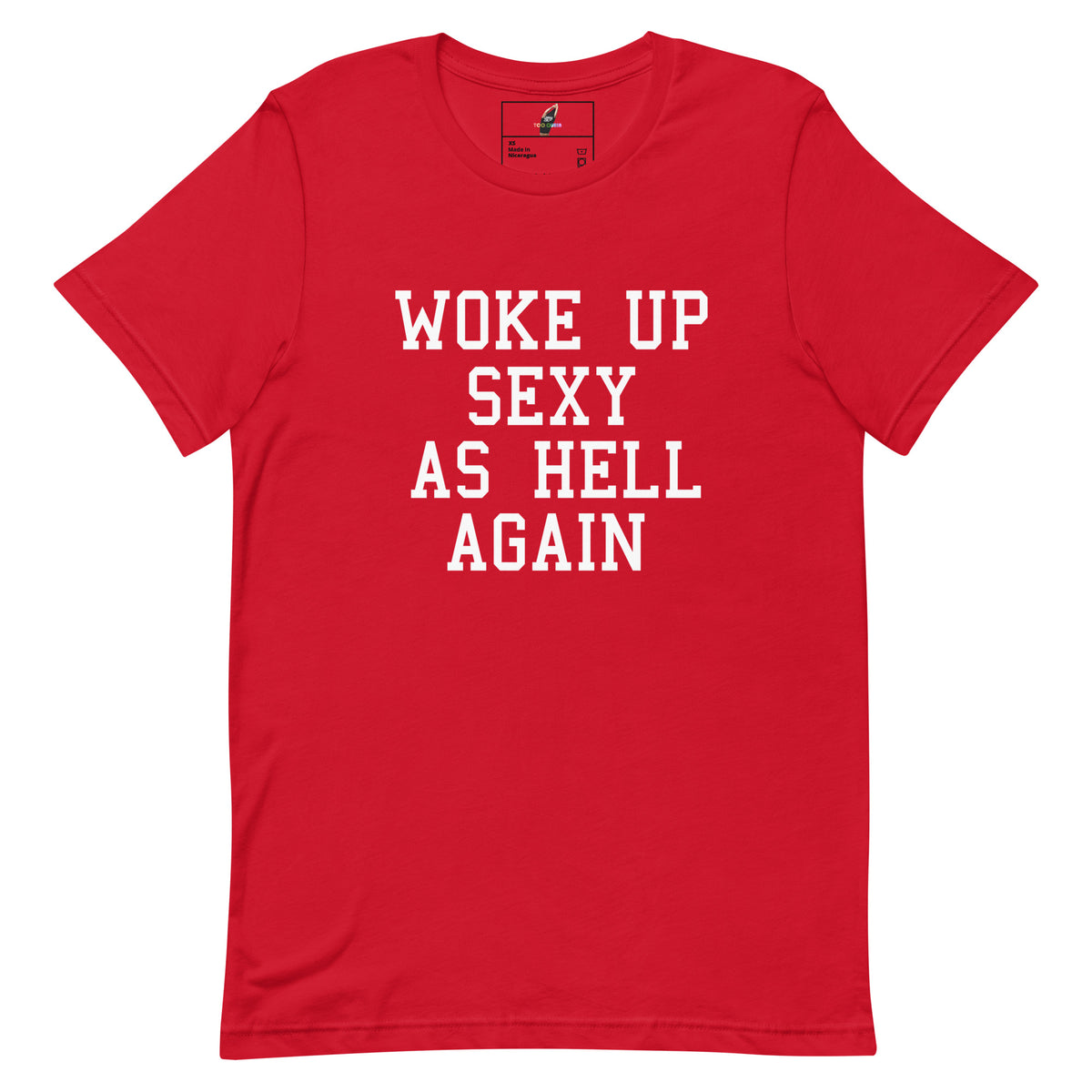 A red short-sleeve crewneck t-shirt with the phrase 'WOKE UP SEXY AS HELL AGAIN' printed in white block letters across the chest, displayed flat against a plain white background.