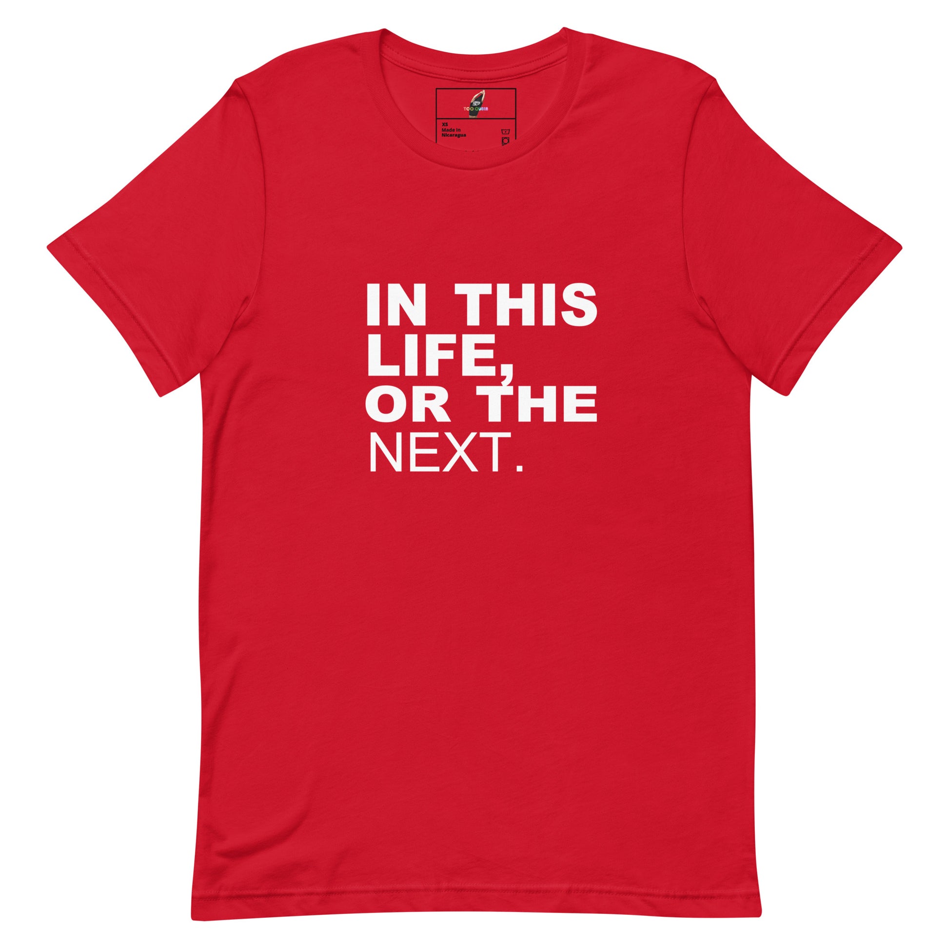A red short-sleeve crewneck t-shirt with the phrase 'IN THIS LIFE, OR THE NEXT.' printed in bold white capital letters on the chest, displayed flat against a plain white background.