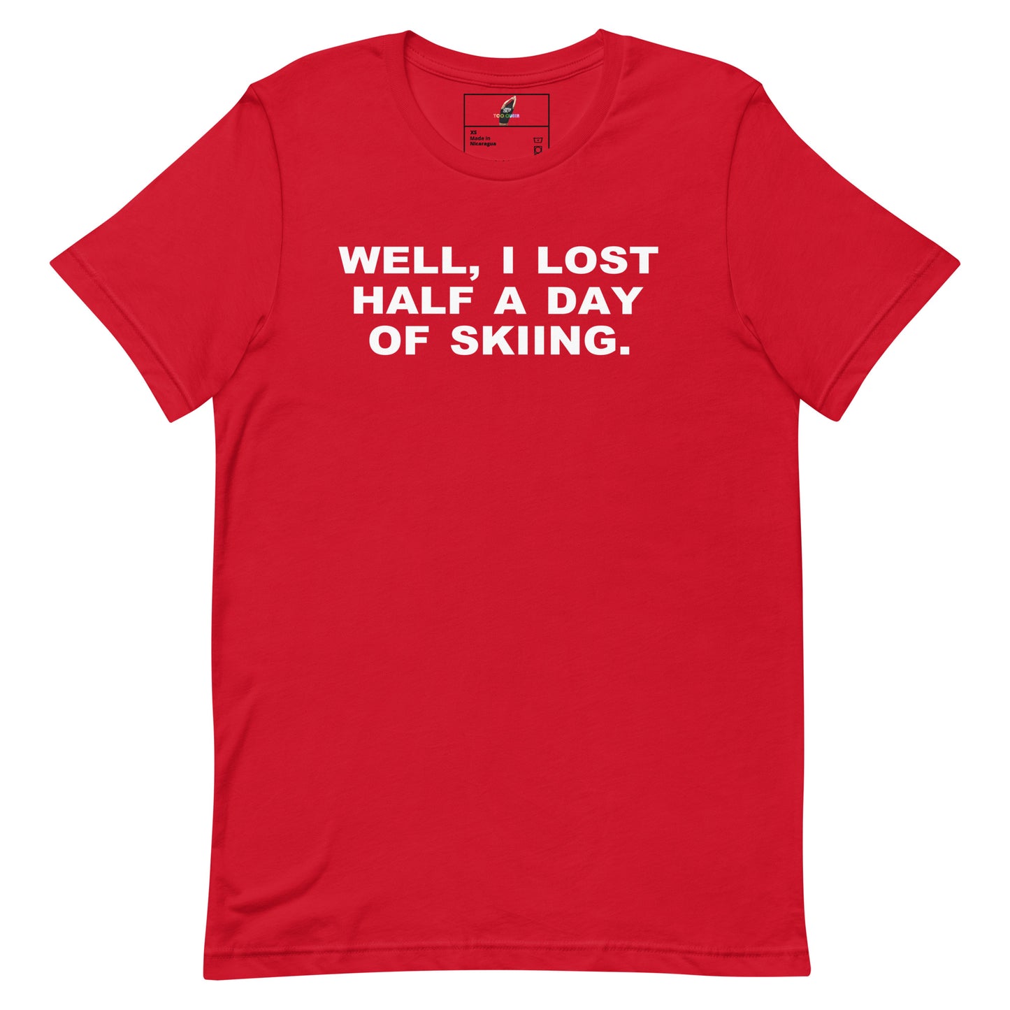 A red short-sleeve crewneck t-shirt with the phrase 'WELL, I LOST HALF A DAY OF SKIING.' printed in bold white capital letters across the chest, displayed flat against a solid white background.