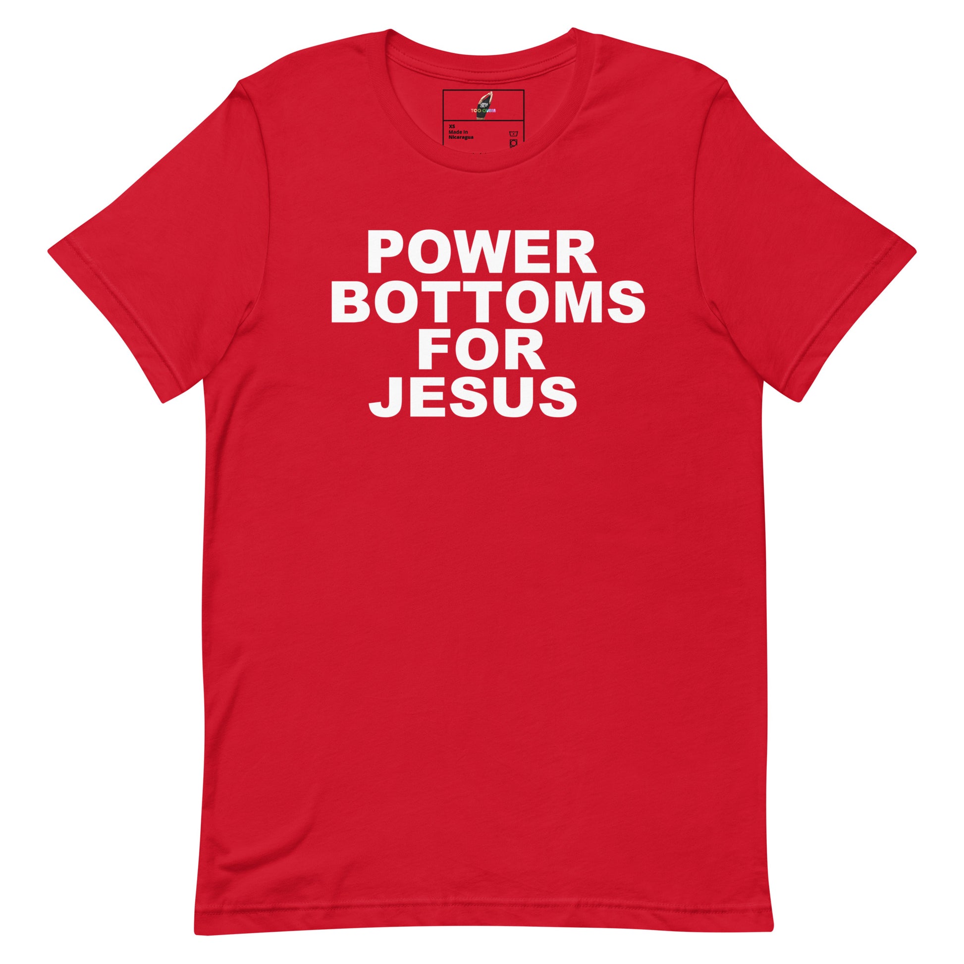 A red short-sleeve crewneck t-shirt with bold white text on the front reading 'POWER BOTTOMS FOR JESUS'. The shirt is displayed flat against a clean white background, showing a small brand label inside the collar.