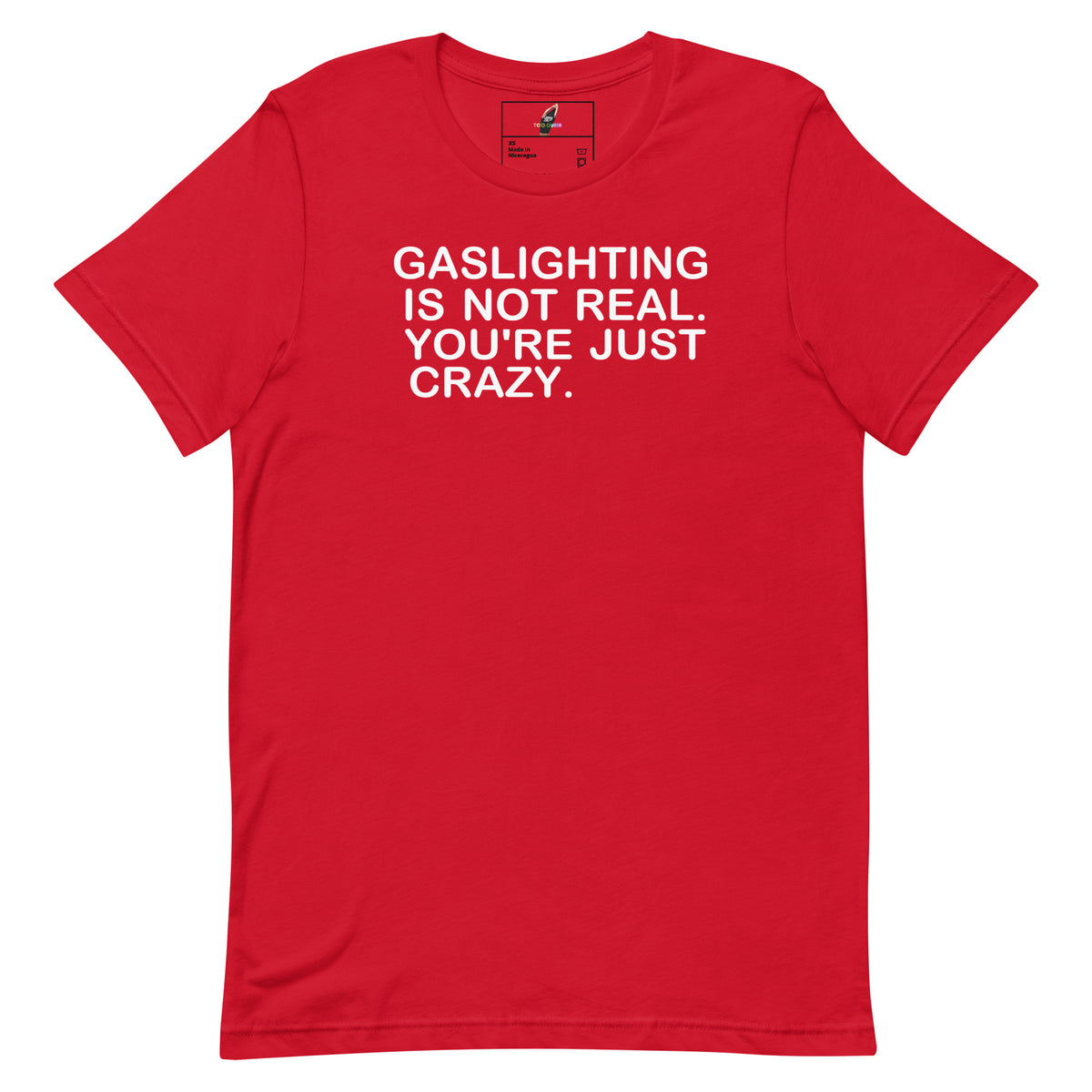 A red short-sleeve crewneck t-shirt with the phrase 'GASLIGHTING IS NOT REAL. YOU'RE JUST CRAZY.