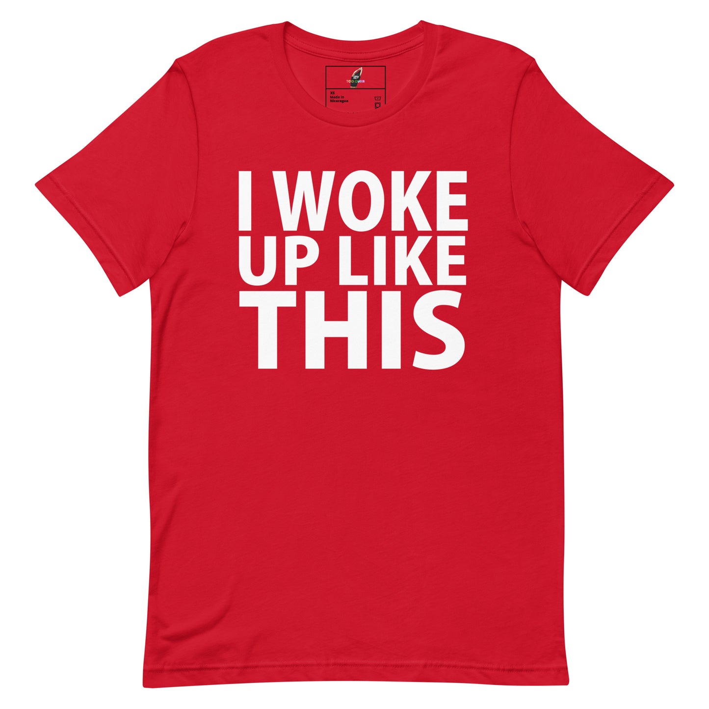 A red short-sleeve crewneck t-shirt with the phrase 'I WOKE UP LIKE THIS' printed in bold white capital letters across the chest, displayed flat against a plain white background.