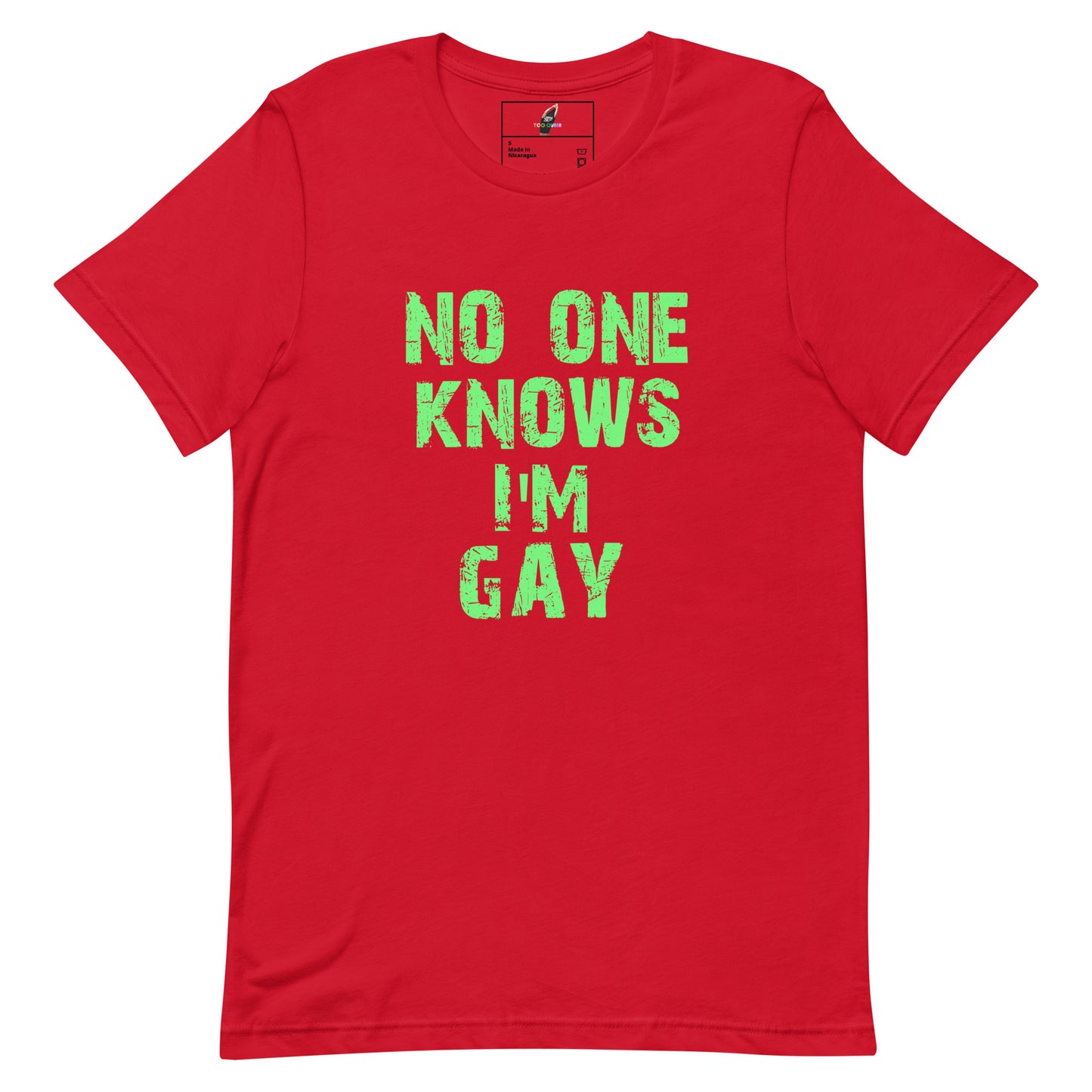 A red short-sleeve crewneck t-shirt with the phrase 'NO ONE KNOWS I'M GAY' printed in a distressed green font on the front, displayed flat against a white background.