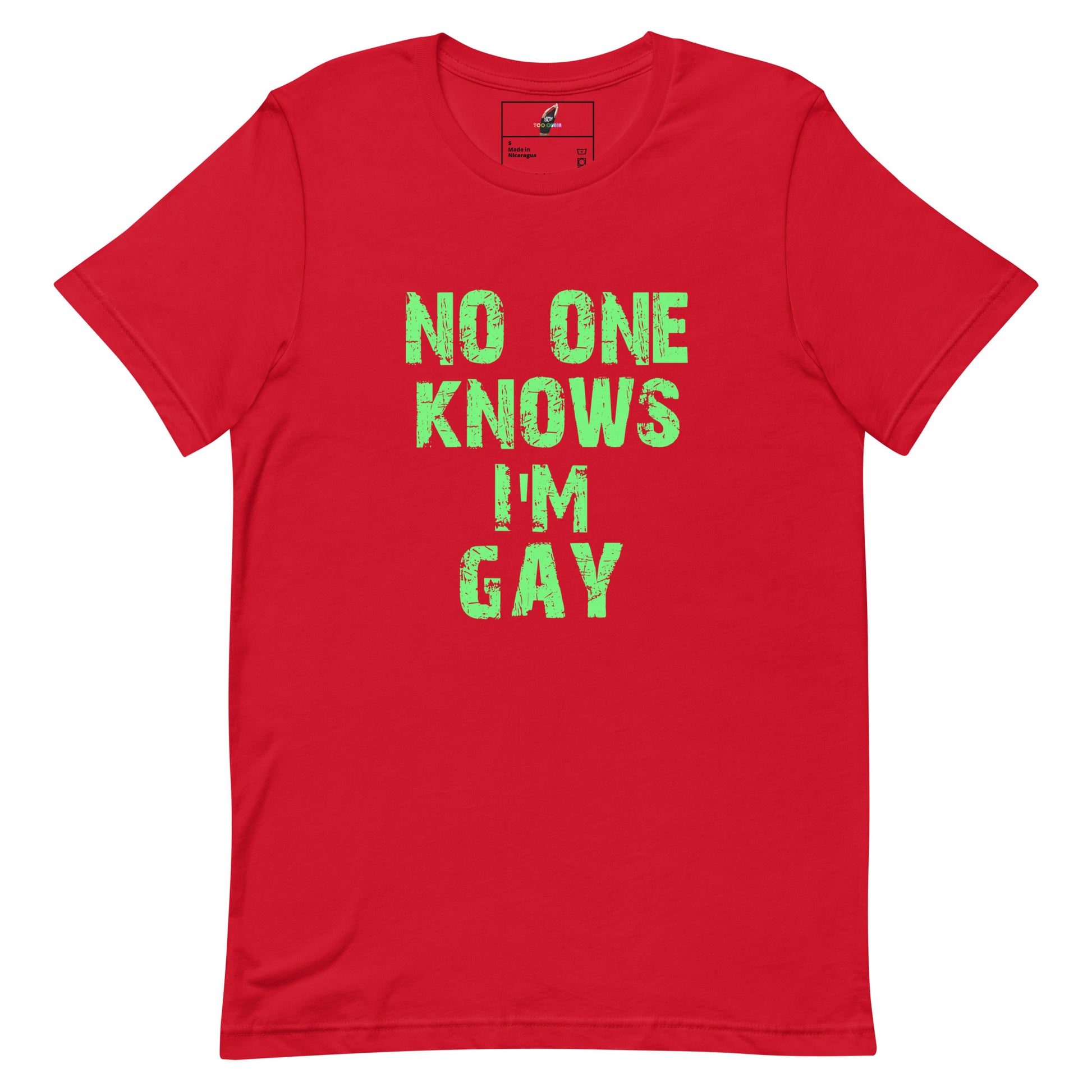 A red short-sleeve crewneck t-shirt with the phrase 'NO ONE KNOWS I'M GAY' printed in a distressed green font on the front, displayed flat against a white background.