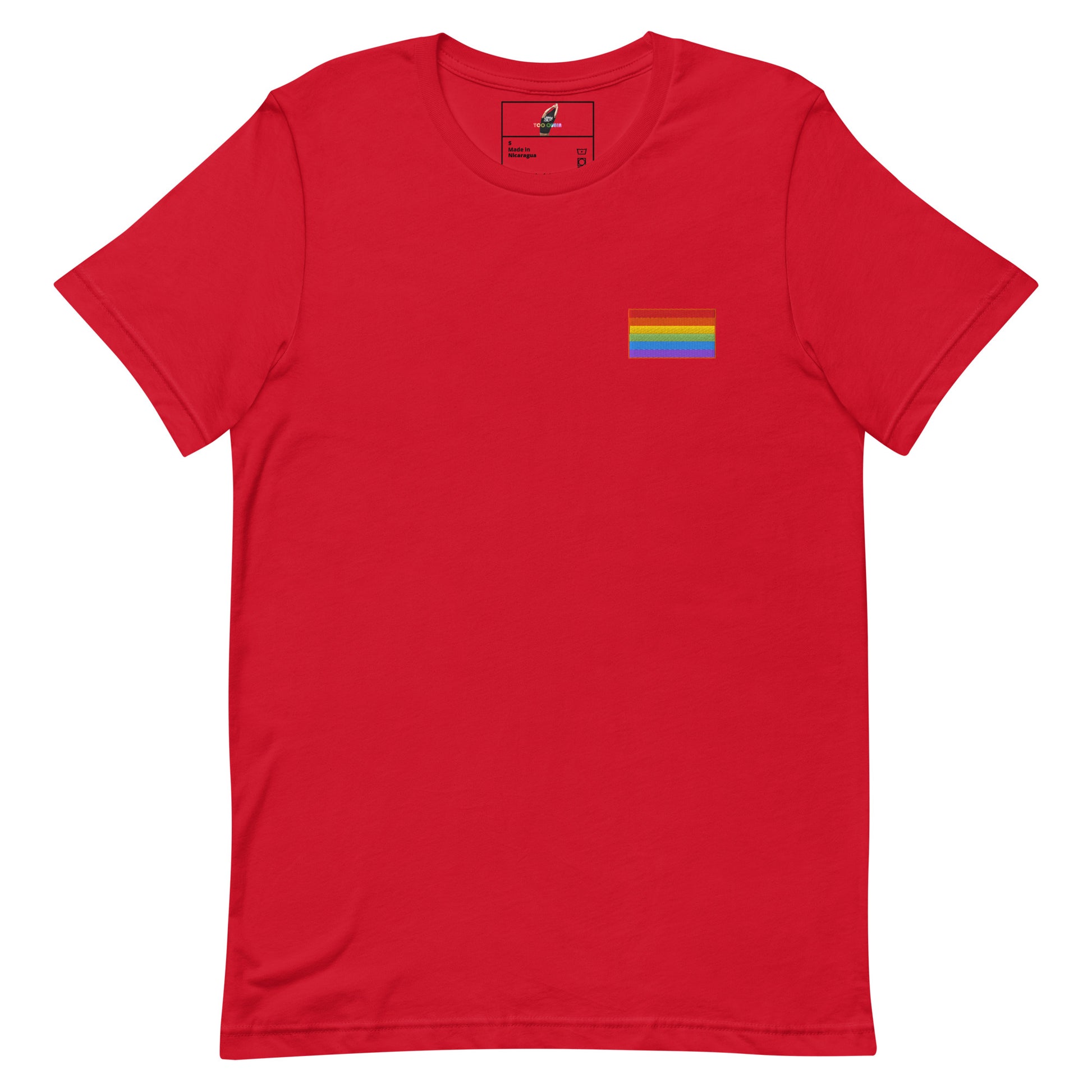 A red short-sleeve crewneck t-shirt with a small rainbow pride flag graphic on the left chest, displayed on a clean white background.