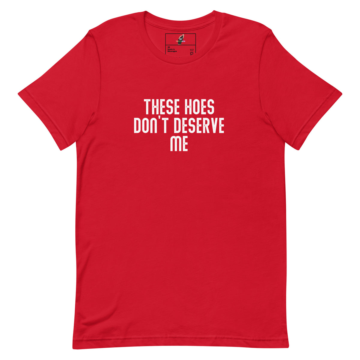 A red short-sleeve crewneck t-shirt with the text 'THESE HOES DON'T DESERVE ME' printed in white capital letters on the chest, displayed flat against a solid white background.