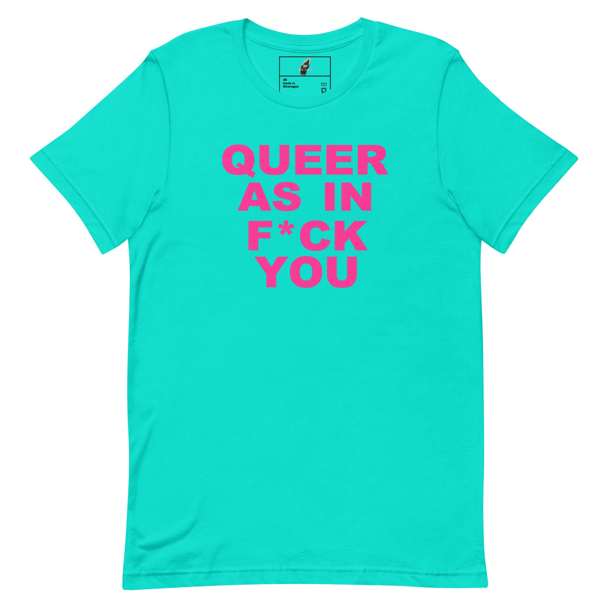 A bright turquoise short-sleeve t-shirt with bold hot pink text on the front reading 'QUEER AS IN F*CK YOU'. The shirt is displayed flat against a solid white background, with a small brand label visible inside the collar.