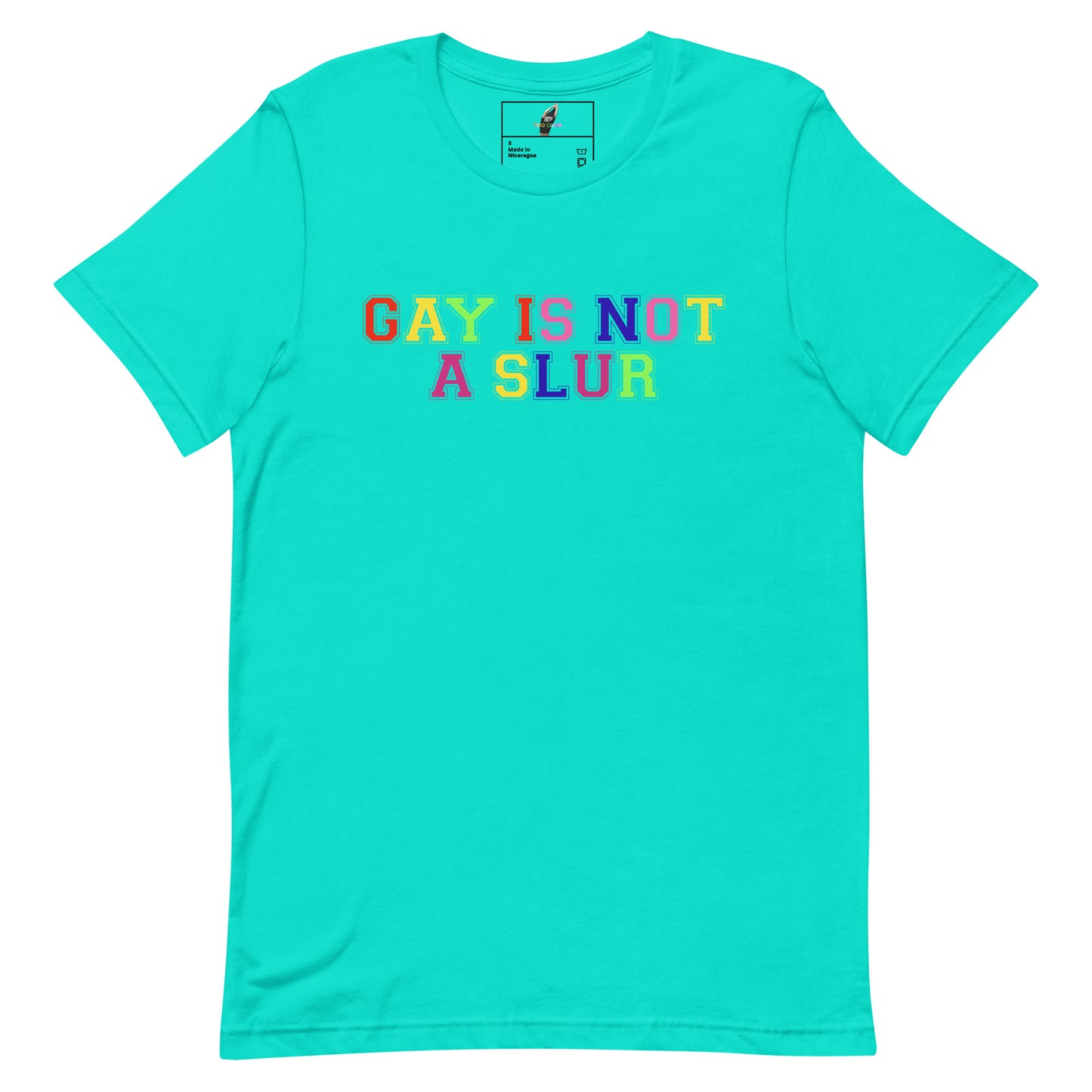 A turquoise short-sleeve crewneck t-shirt featuring the text 'GAY IS NOT A SLUR' printed across the chest in a rainbow gradient font. The shirt is displayed flat against a solid white background.