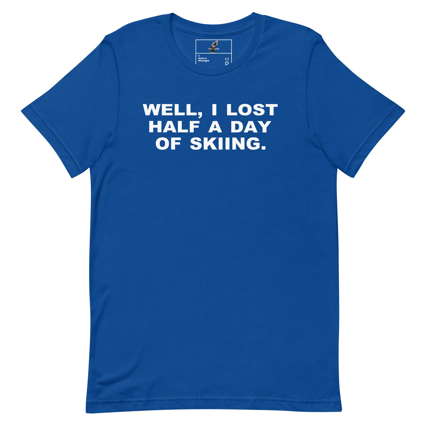A royal blue short-sleeve crewneck t-shirt with the phrase 'WELL, I LOST HALF A DAY OF SKIING.' printed in bold white capital letters across the chest, displayed flat against a solid white background.