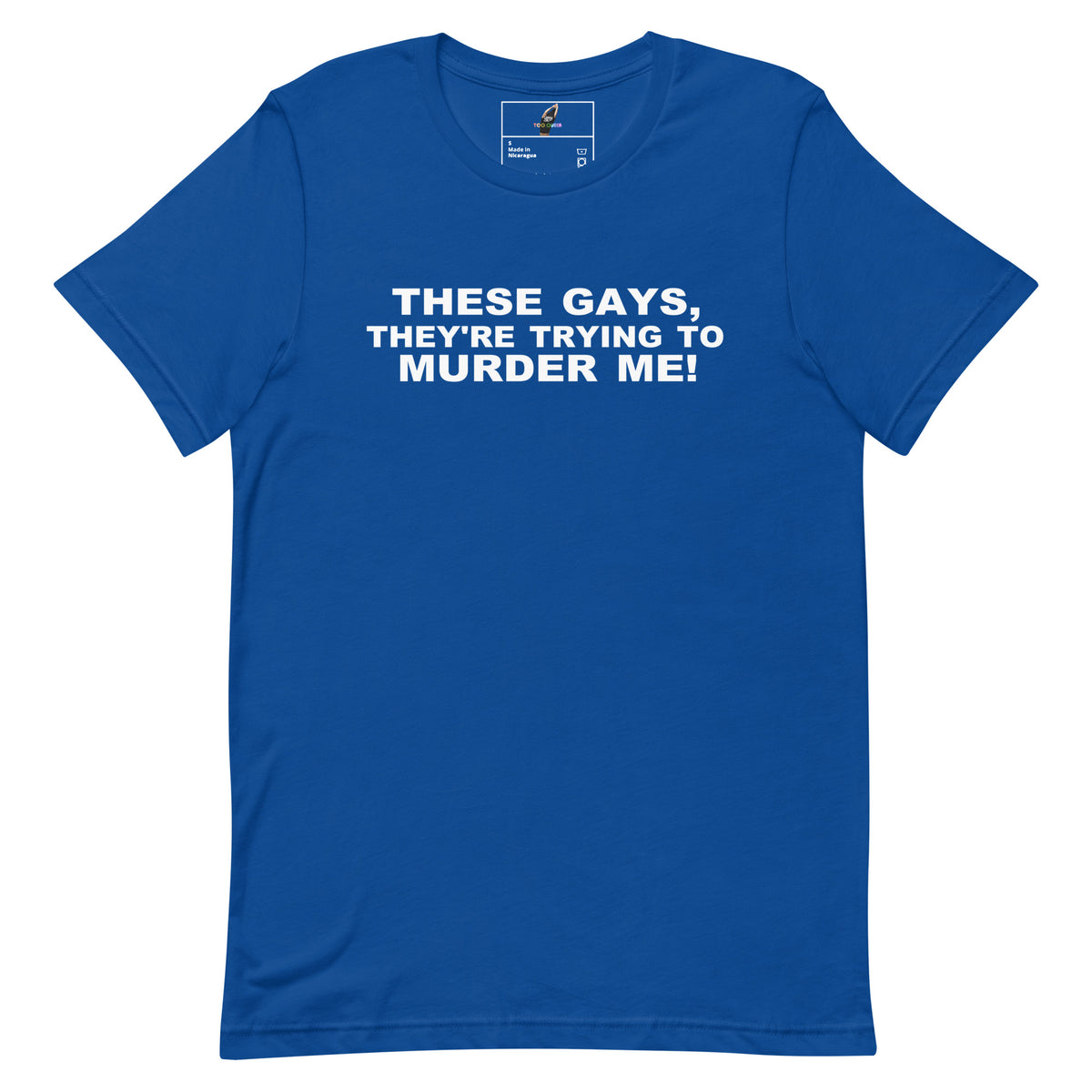 A royal blue short-sleeve t-shirt with bold white text on the chest reading 'THESE GAYS, THEY'RE TRYING TO MURDER ME!' displayed on a clean white background.