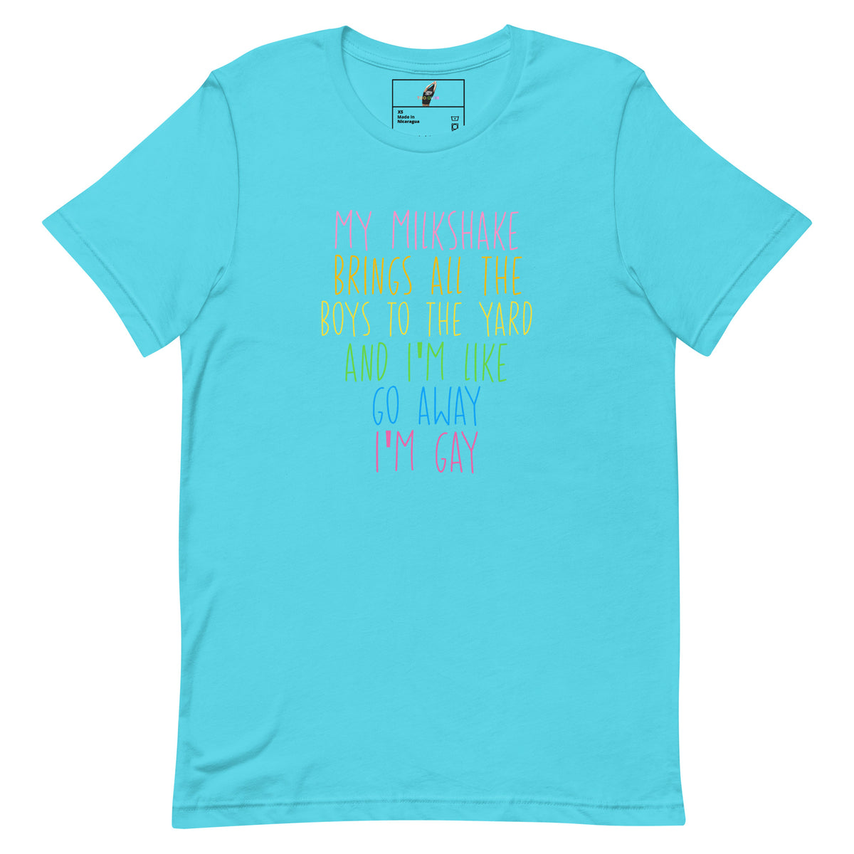 A light blue short-sleeve t-shirt with a colorful text graphic on the front that reads, 'MY MILKSHAKE BRINGS ALL THE BOYS TO THE YARD AND I'M LIKE GO AWAY I'M GAY'. The shirt is displayed flat against a solid white background.
