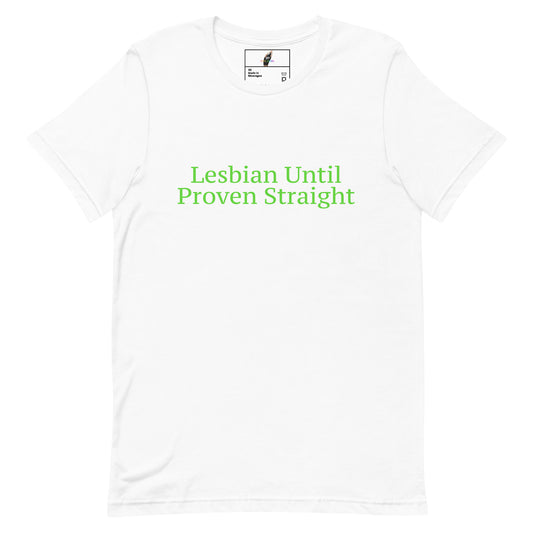 A white short-sleeve crewneck t-shirt with the phrase 'Lesbian Until Proven Straight' printed in green text across the chest. The inner neck label features a small logo with a feather and the text 'Eternal Flame'.